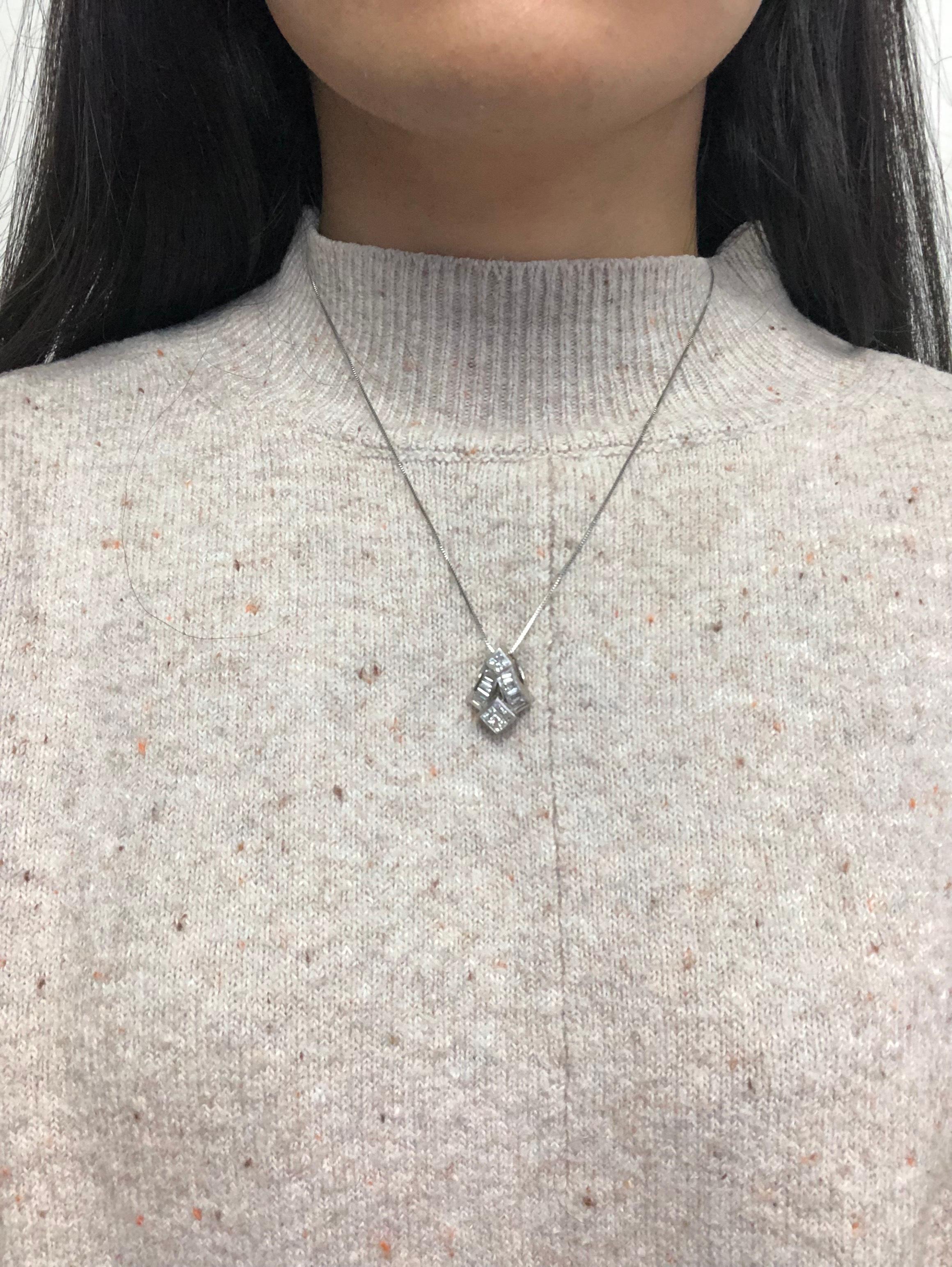 Embrace enduring love and timeless elegance with this exquisite pendant necklace. Expertly crafted from 14 karats white gold and polished to a brilliant shine, this pendant necklace showcases a sophisticated design featuring an enchanting