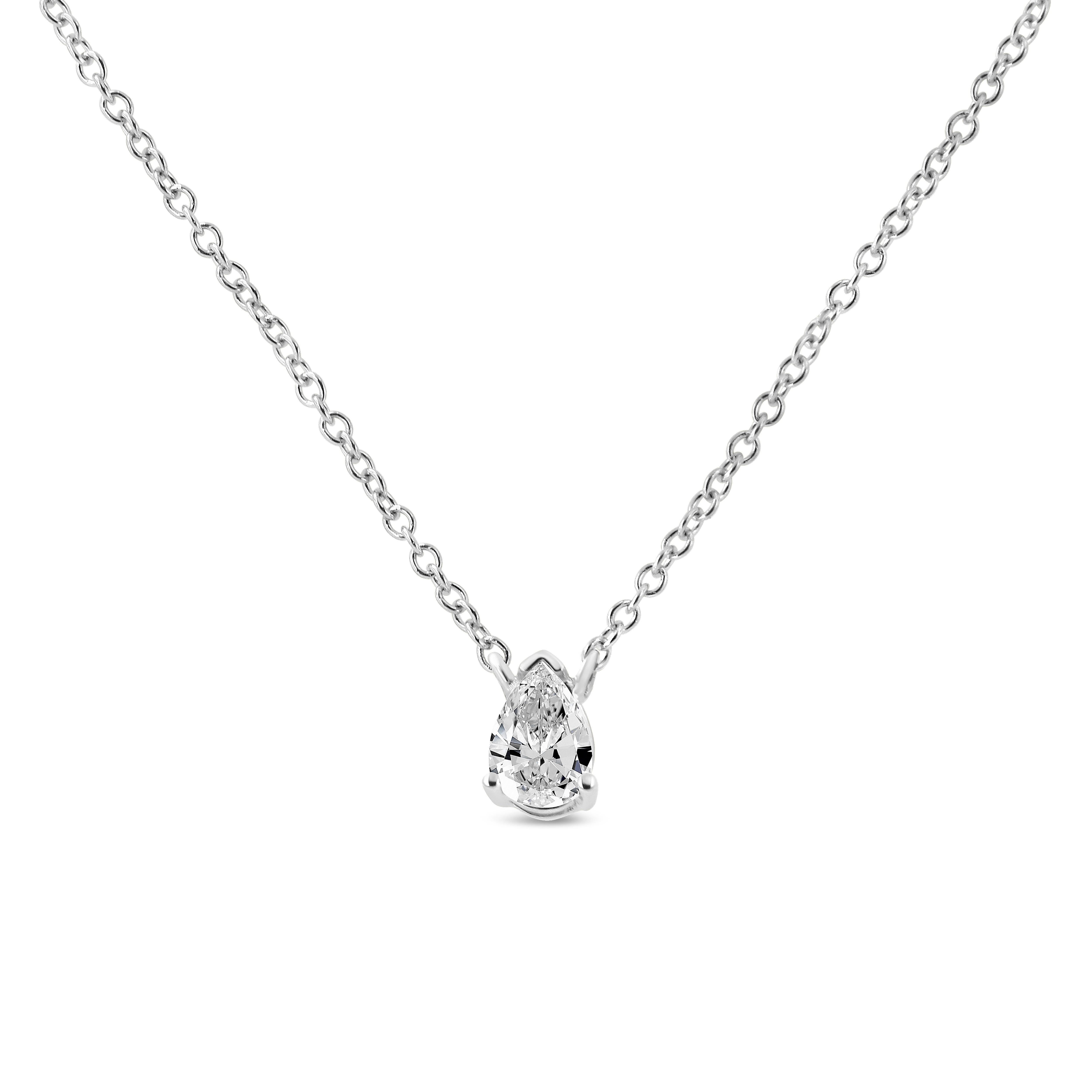Exquisitely crafted, this solitaire diamond pendant necklace brilliantly showcases a 1/5 cttw pear-shaped diamond, nestled in a 4-prong prong. It is crafted in genuine 14k white gold, a metal that will stay tarnish free for years to come. The