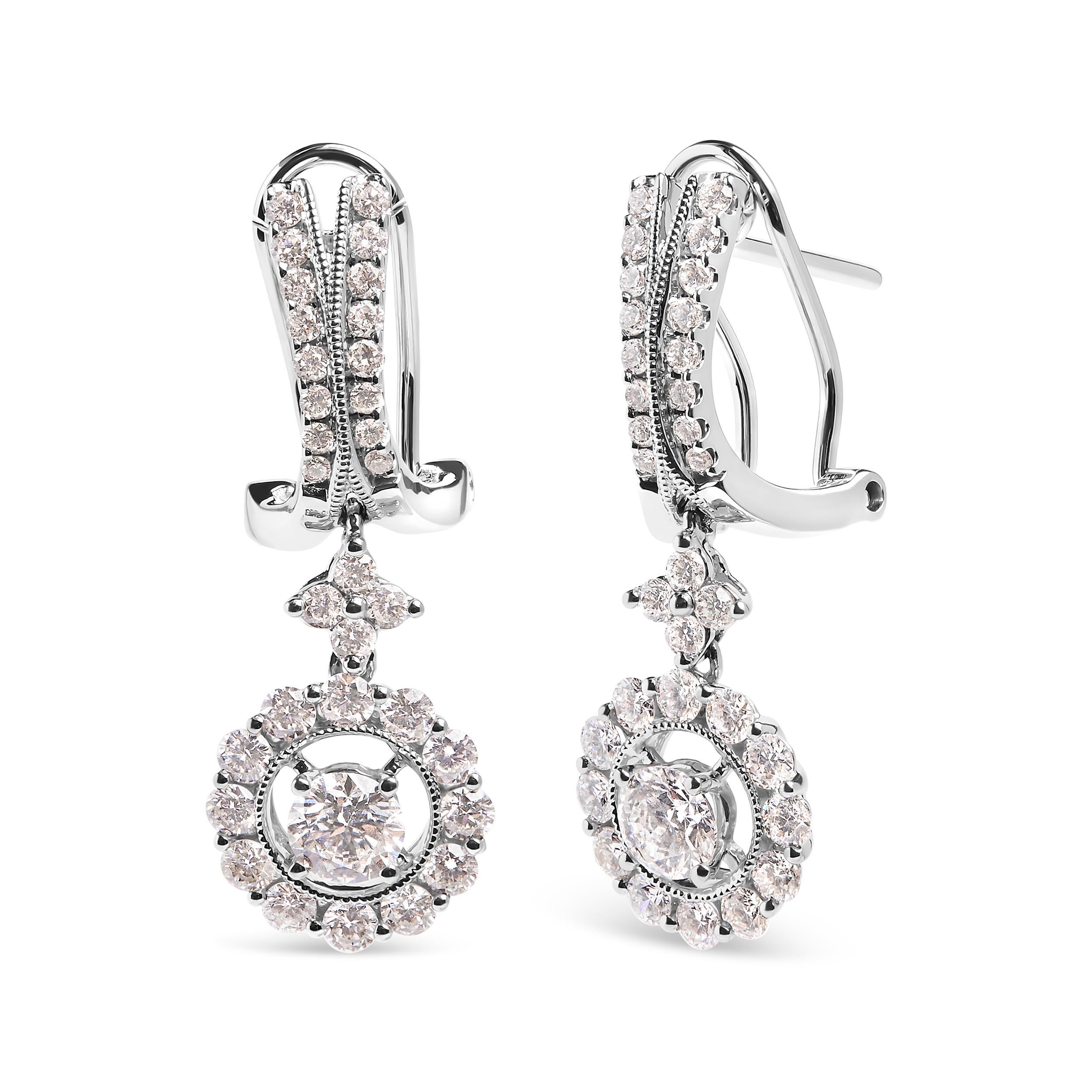 Introducing a mesmerizing masterpiece that will make you the epitome of elegance. Crafted in 14K white gold, these enchanting drop and dangle earrings are adorned with a breathtaking array of 66 round-cut diamonds. With a total weight of 1 7/8 cttw,