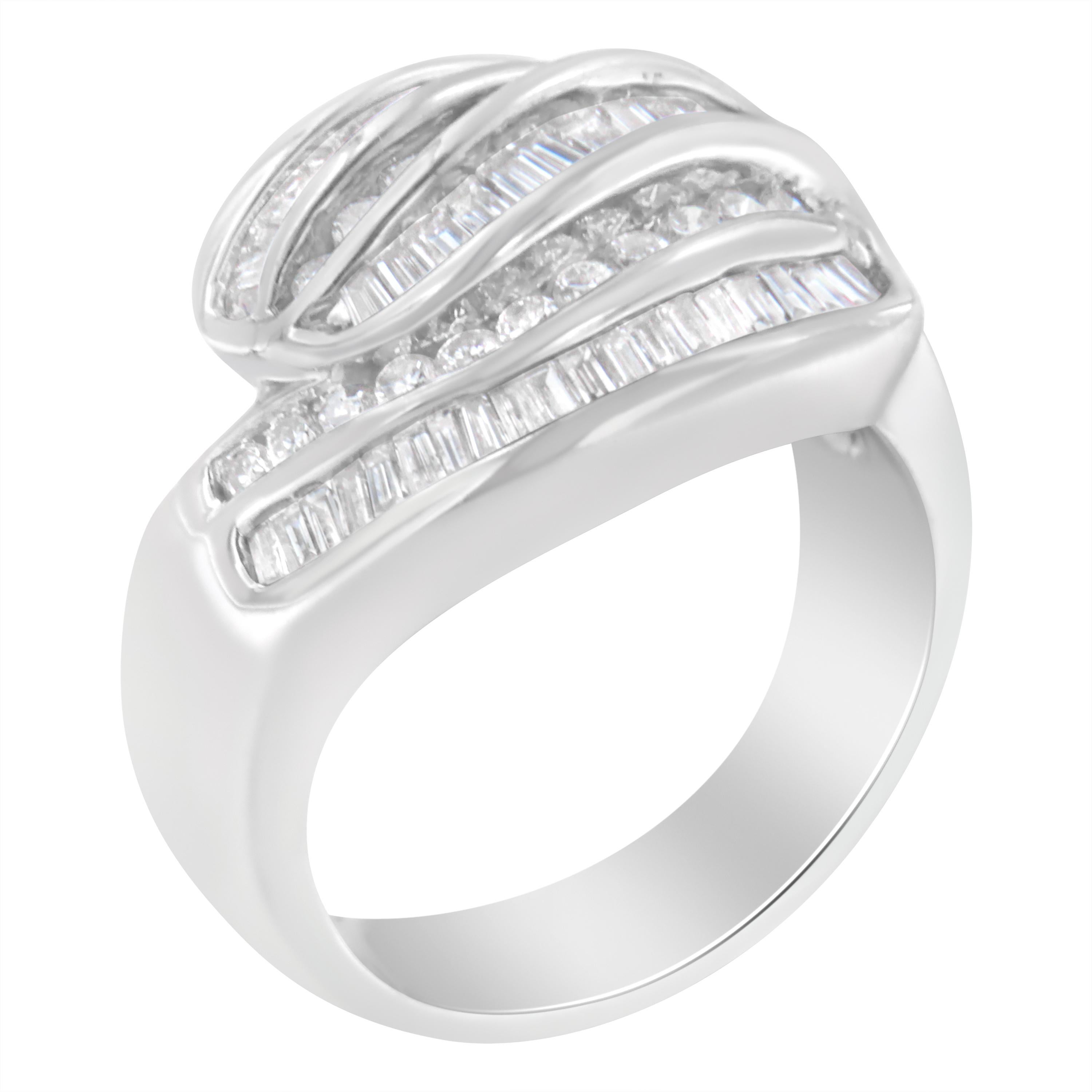 An elegant diamond band that sparkles with five rows of alternating round brilliant cut and baguette diamonds. The wide band is crafted in cool 14 karat white gold. It has a total diamond weight of 1 carat. This is a rare one-of-a-kind piece, and