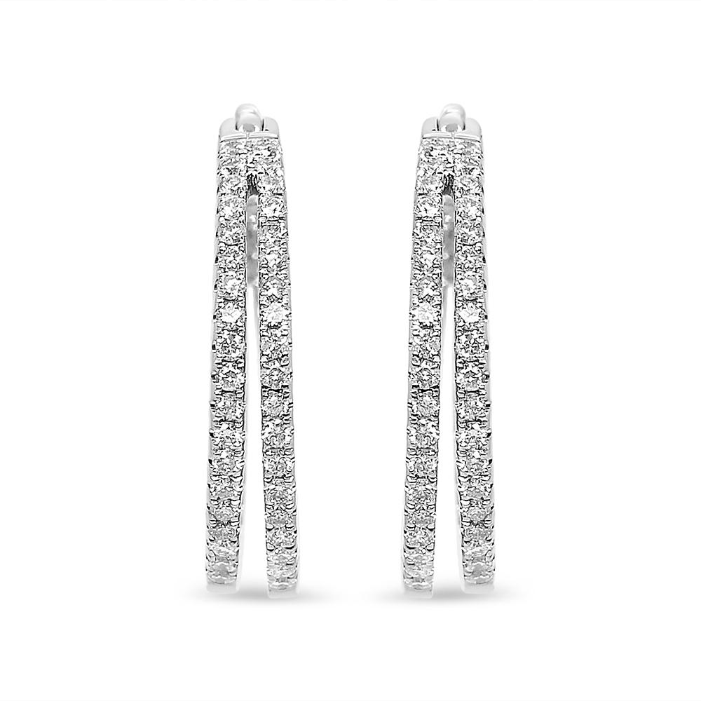 Steal the spotlight with these stunning diamond hoop earrings. Created in cool 14K white gold, each clever double-row hoop showcases layered ribbons sparkling with diamonds along the outside front and inside back edge. Captivating with 1 cts. t.w.