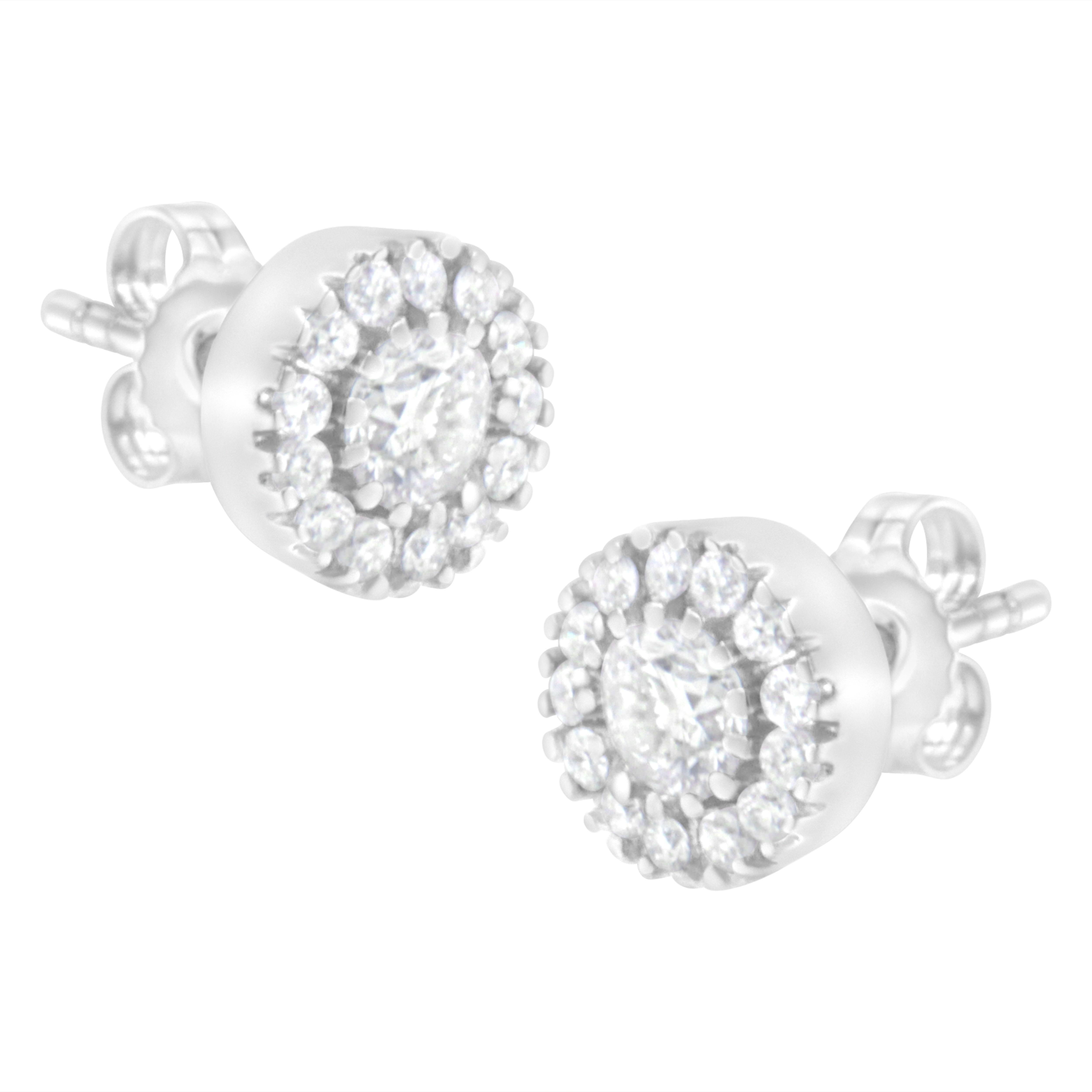 Time to make your appearance glow with this shimmering pair of 1 ct tdw stud earrings. The pair made with 14k white gold also features 2 central prong-set, round-cut diamonds and 26 smaller round-cut diamonds arranged in a pave setting. These