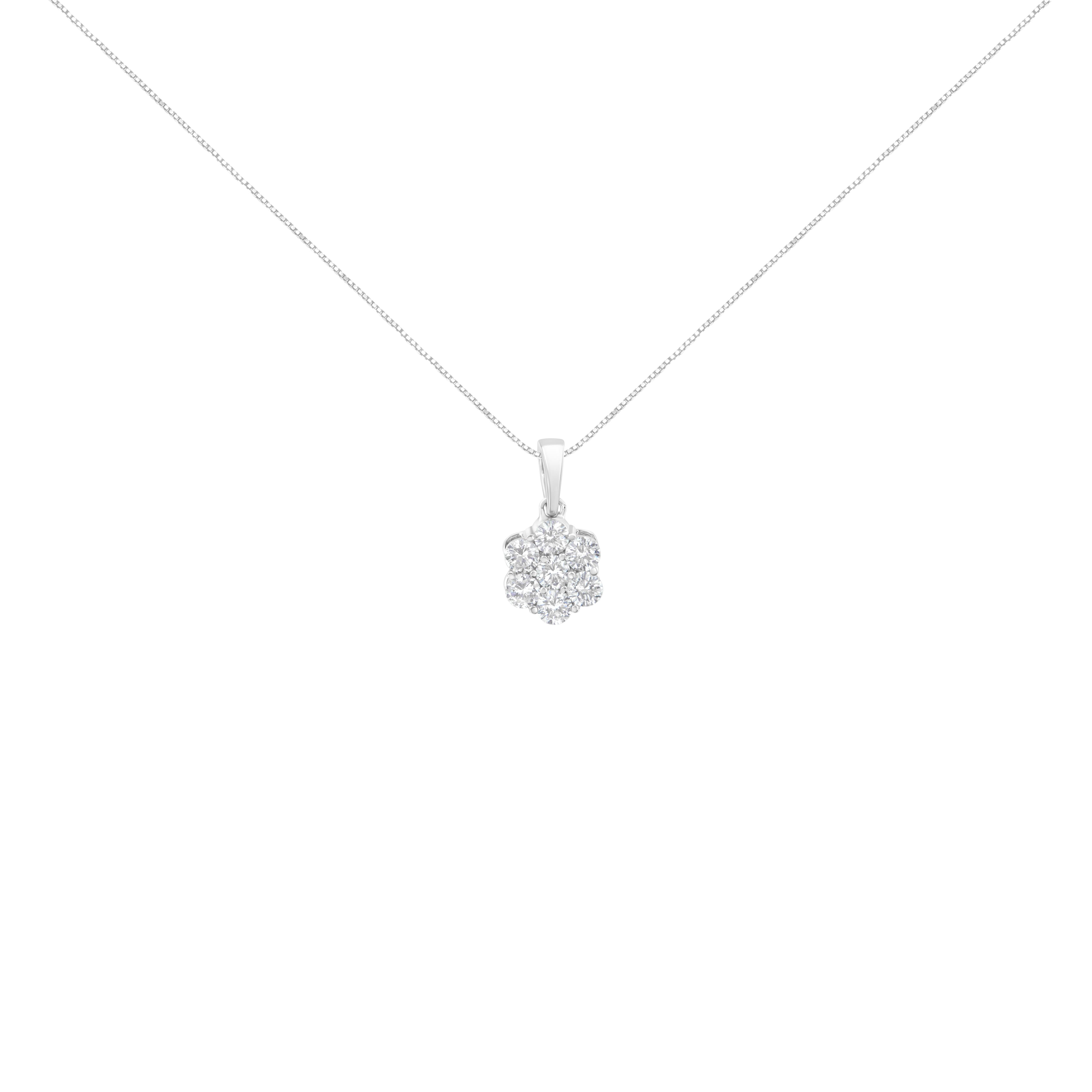 A simple and elegant necklace to compliment your outfit. A delicate flower is created by a cluster of 7 shimmering round cut diamonds in a prong setting. 1ct TDW of diamonds is showcased in this 14k white gold design that hangs from a box chain and
