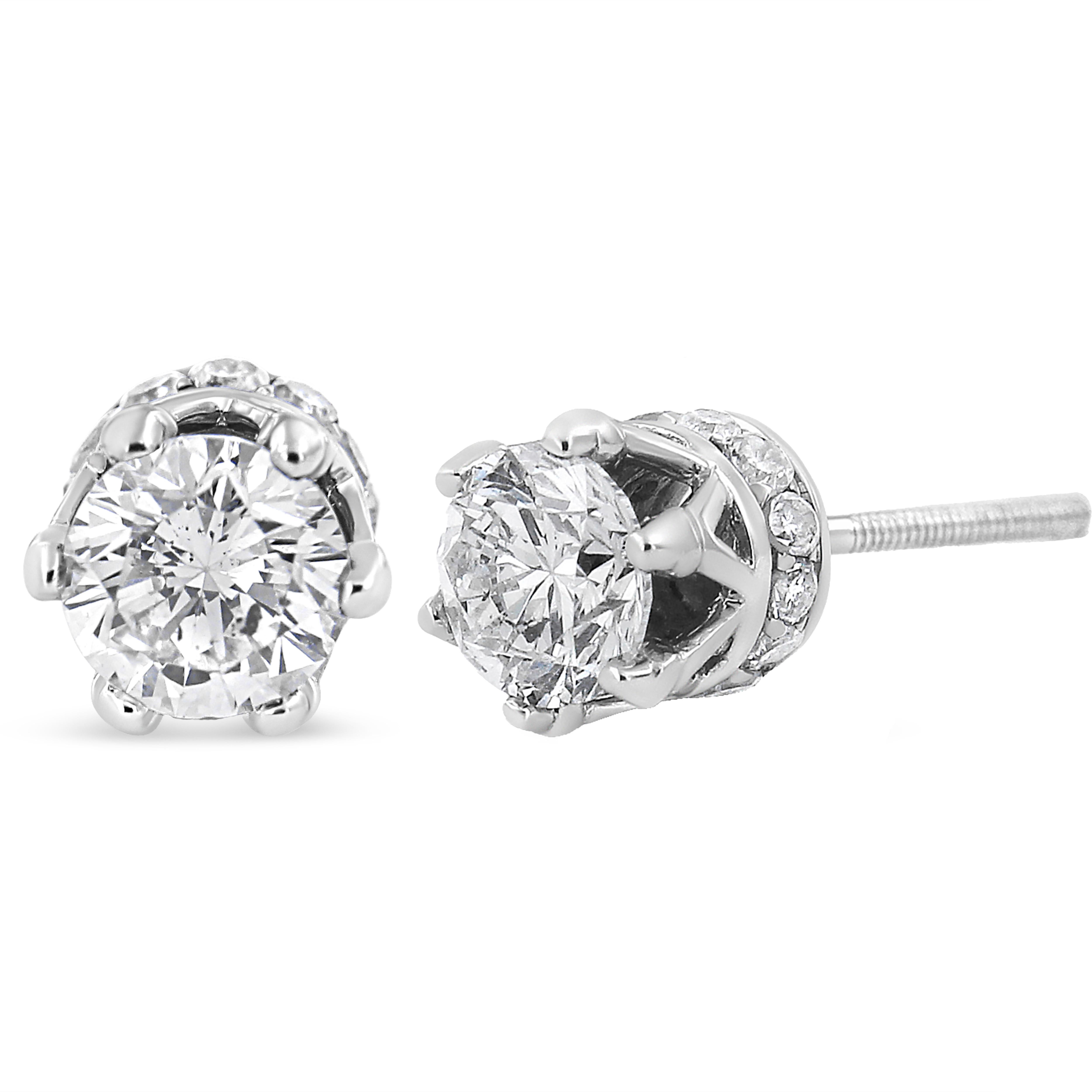 With regal hidden details, these diamond stud earrings are anything but ordinary. From the front, these 14kt white gold studs look like solitaires with a multi-prong setting. But the sideview brings into focus the crown design. Round diamond accents