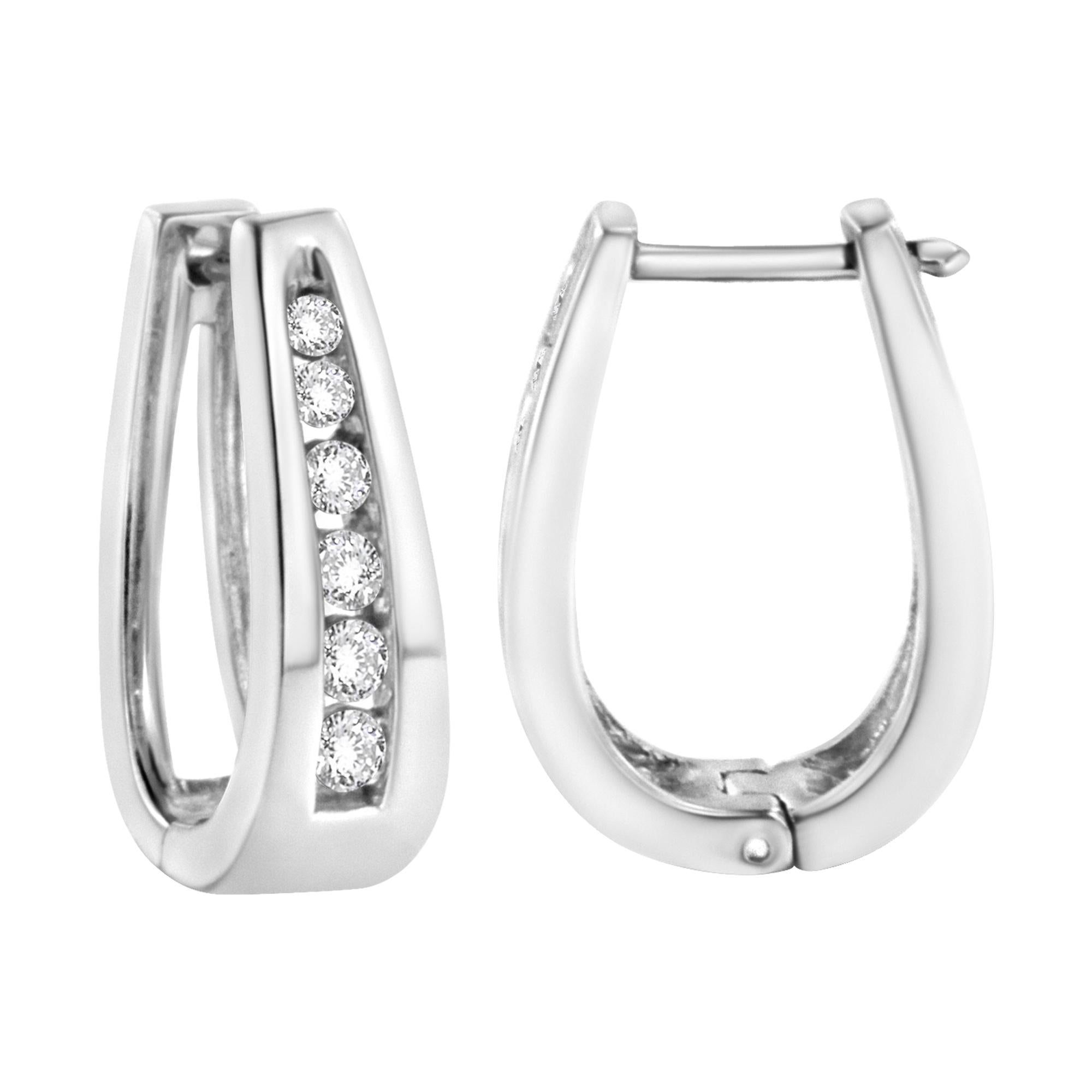 Fashioned in stunning 14k white gold, these beautiful hoop earrings feature 1.0 ct of brilliant round cut diamonds in a channel setting that delicately flow half way around the outside of the hoop. A classic piece you can wear everyday.

Product