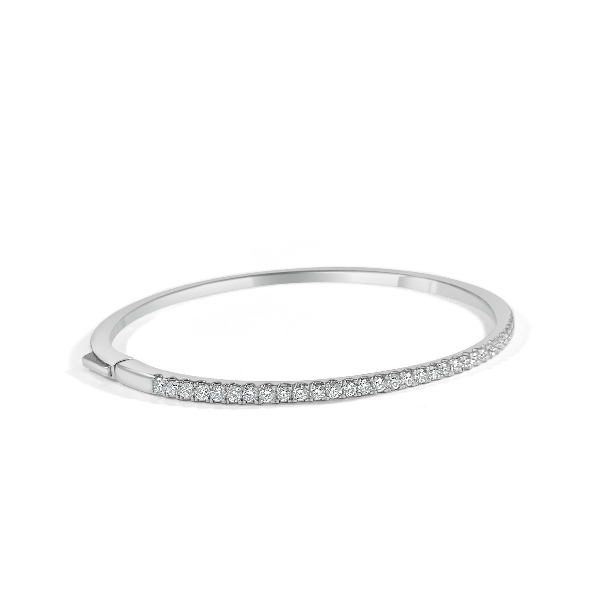 Are you looking to add some sophistication to your ensemble? This elegant diamond bangle for features a row of brilliant round diamonds set in 14k gold. Diamond Color and Clarity is GH SI1-SI2. 
-14K Gold
-1.00 ct. Natural White Diamonds
-Diamond