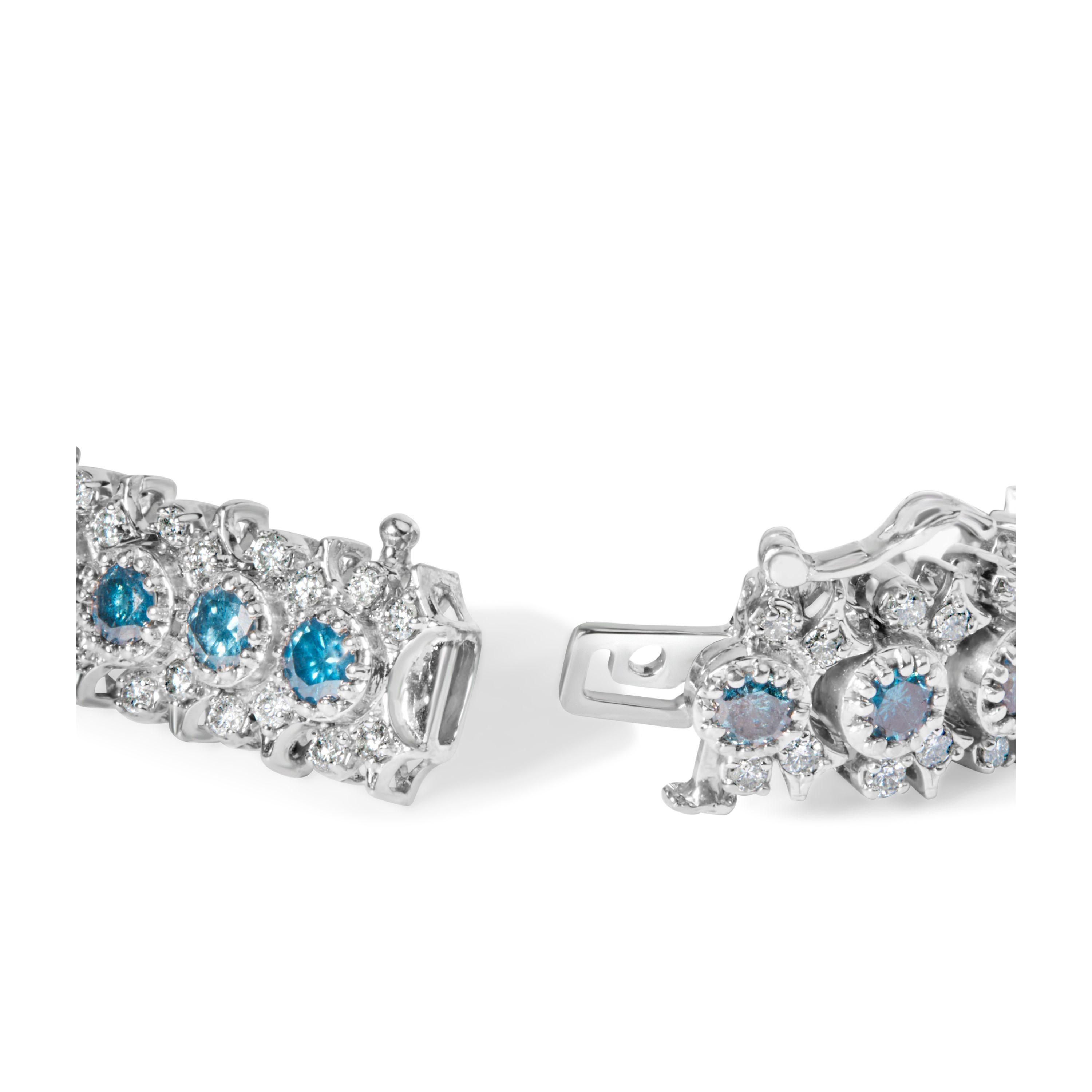 L'Elegance redéfinie, ce bracelet à couper le souffle, orné d'or blanc 14 carats et embrassé d'une finition rhodiée, rayonne d'un éclat inégalé. Imaginez six carats de diamants bleus enchanteurs, aux teintes profondes et évocatrices, magistralement