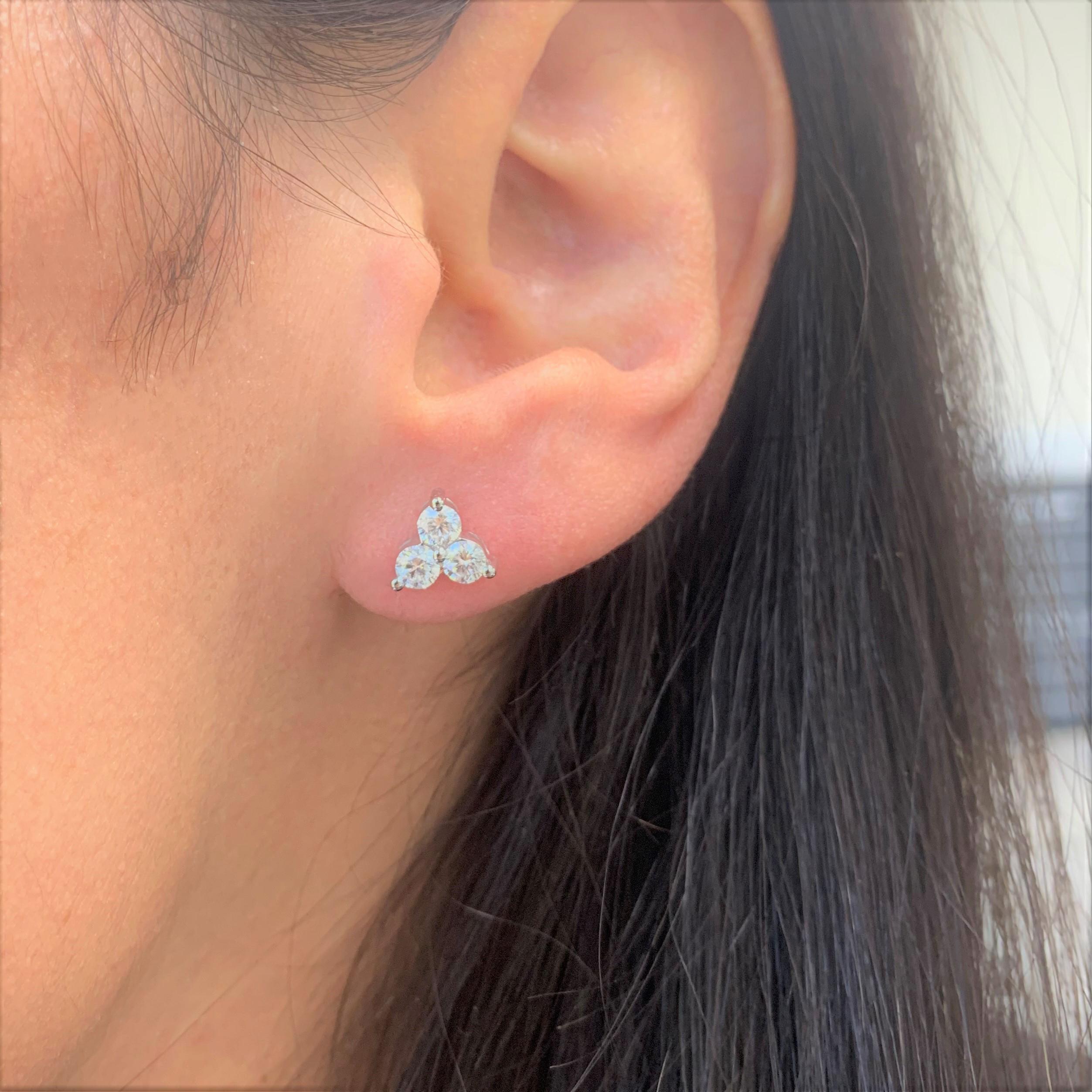These Beautiful and Classic 3-Stone Diamond Cluster Stud Earrings are crafted of 14K White Gold and feature 6 white round Diamonds weighing 0.97cts, has butterfly push-backs for closure. Diamond Color & Clarity is GH-SI1
 
 14K White Gold
 0.97cts