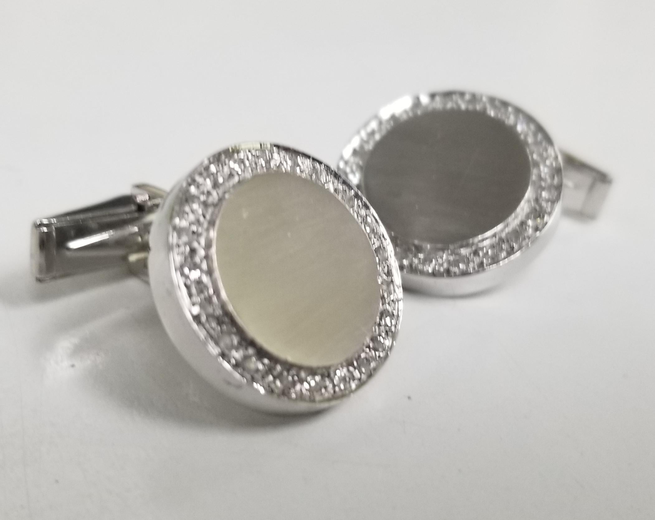 14k white gold diamond cuff links with brushed finish containing 42 single cut diamonds of very fine quality weighing 1.00cts.