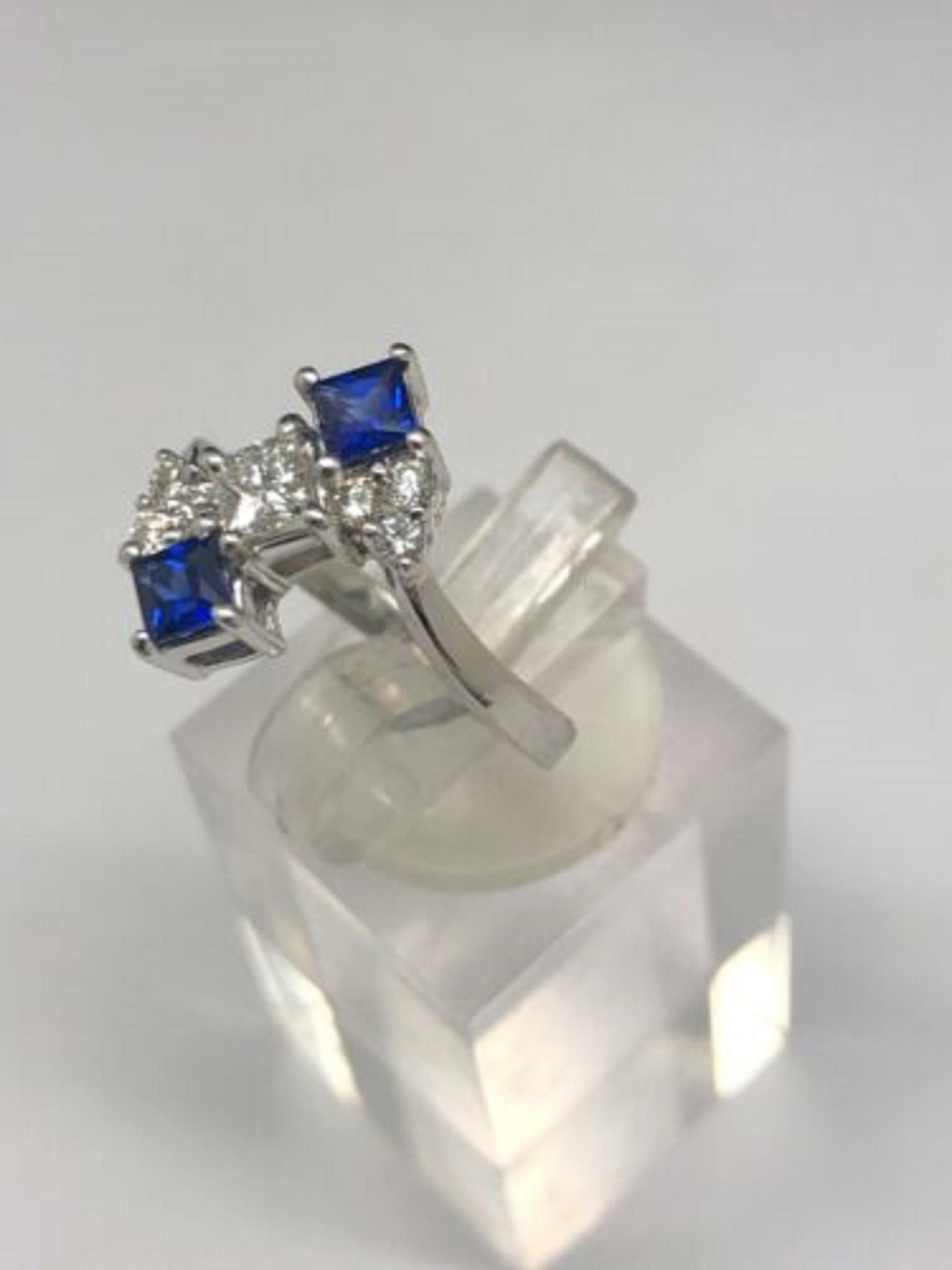 Up for sale:

This absolutely stunning solid 14k white gold princess cut blue sapphire gemstone with princess and round cut natural diamonds cocktail ring. This ring is featuring approx. 0.60ctw in blue sapphire gemstone and .48ctw in princess and