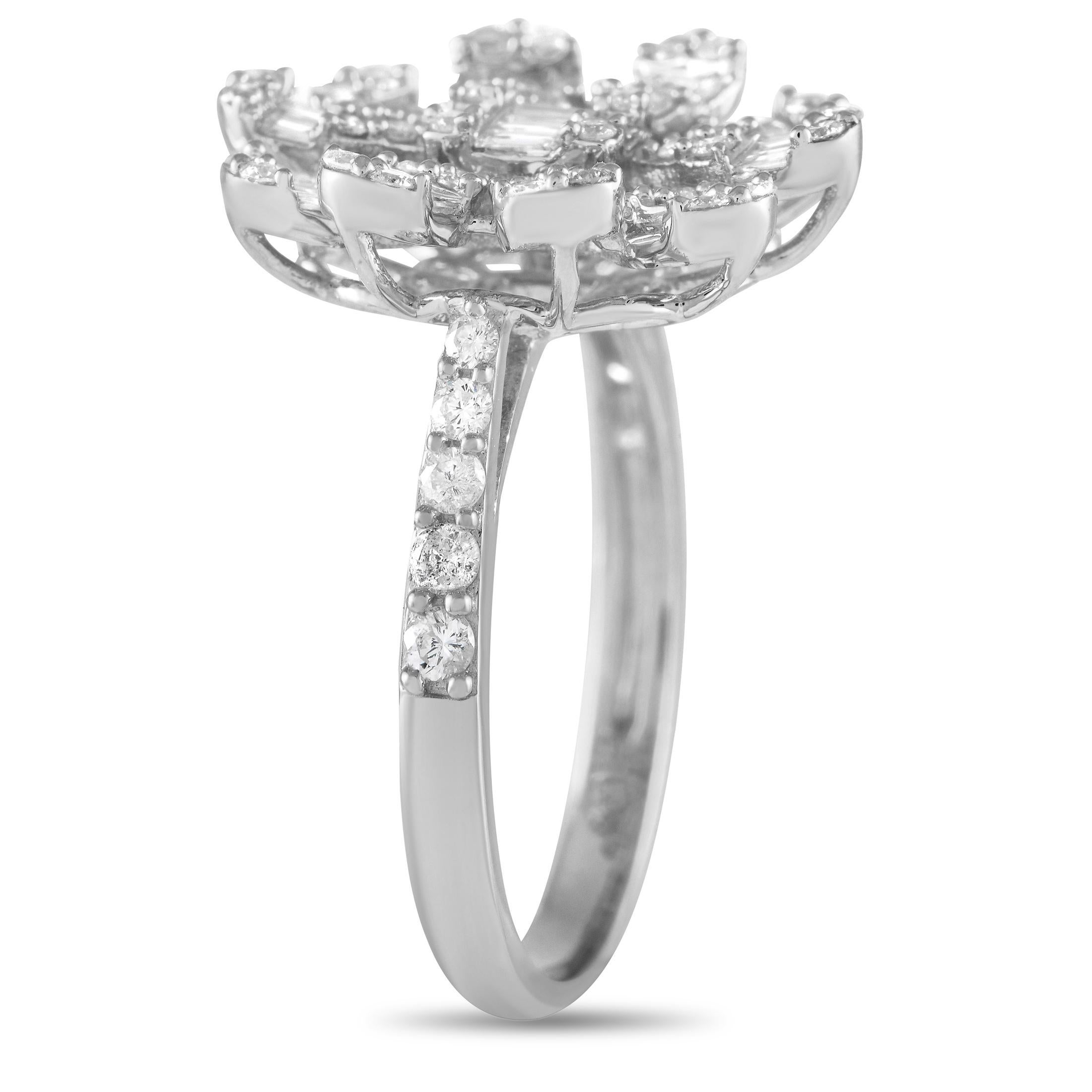 Inspired by a flower that follows the sun, this diamond ring looks like a bright ray of sunshine on the finger. It features a slim 1mm band in 14K white gold topped with a dazzling combination of round and baguette diamonds in a sunflower