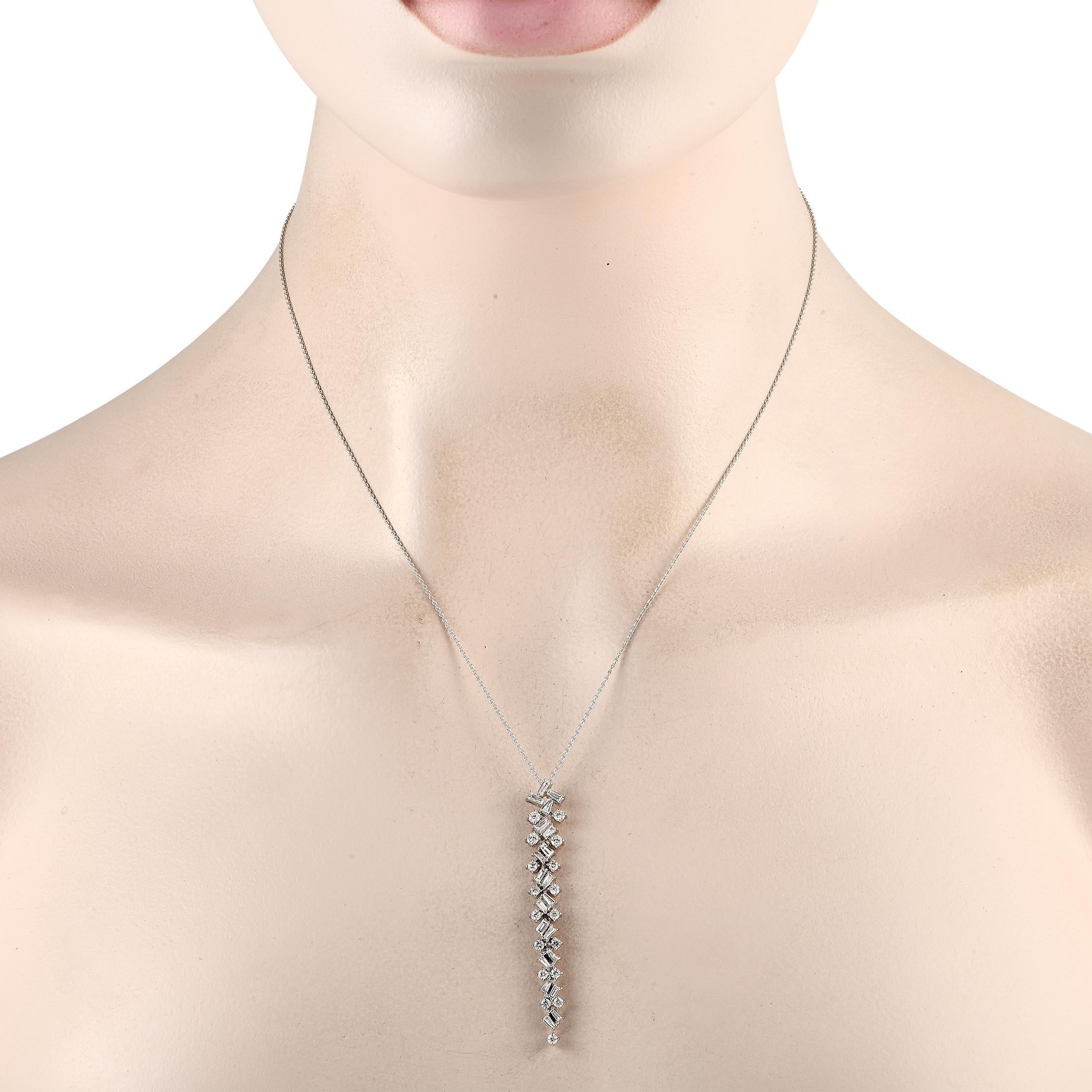 A dazzling array of Diamonds with a total weight of 1.0 carats make this luxury necklace instantly captivating. This pieces breathtaking 14K White Gold pendant is suspended from a 20 chain and measures 2.10 long by 0.25 wide.This jewelry piece is