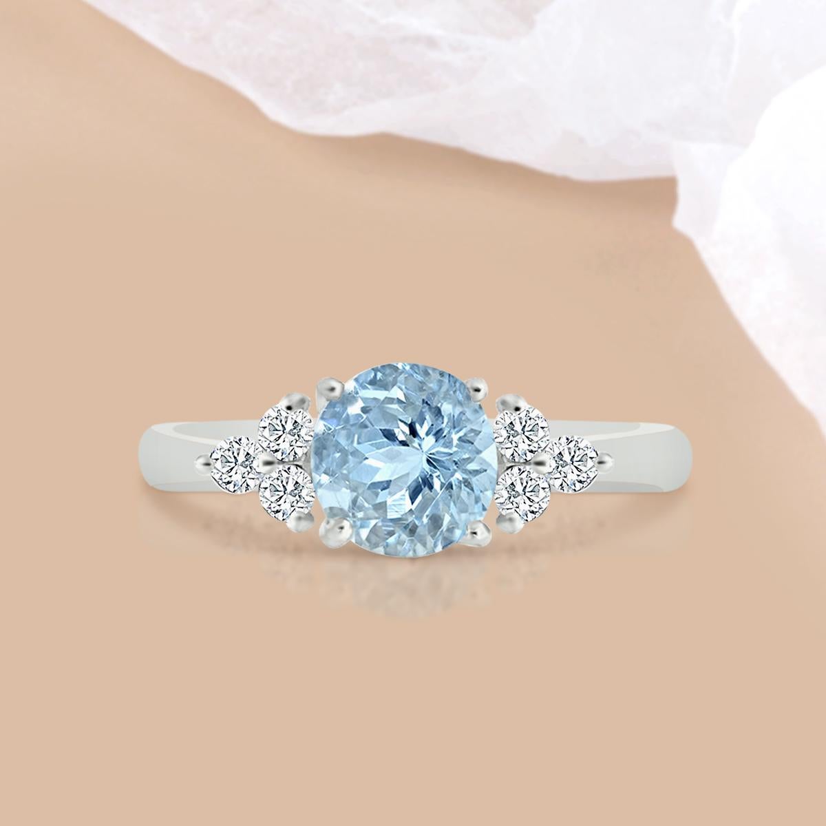 An Aquamarine Ring Is Both Fashionable and Distinctive. 
This Lovely 14K White Gold Round Shaped Aquamarine and Diamond Ring Is in Such Huge Demand.
A 7mm Aquamarine Gemstone Is Giving a Very Classy Look to This Beautiful Ring, Looks Like the