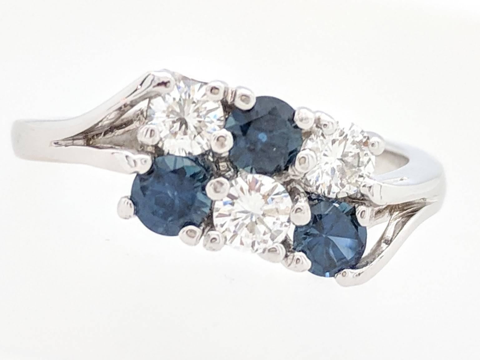 Ladies 14k White Gold 1.20ctw Diamond & Sapphire Ring Size 7

You are viewing a beautiful ladies diamond and sapphire ring.  This ring is crafted from 14k white gold and weighs 3.4 grams.  It features (3) .20ct natural round diamonds and (3) .20ct