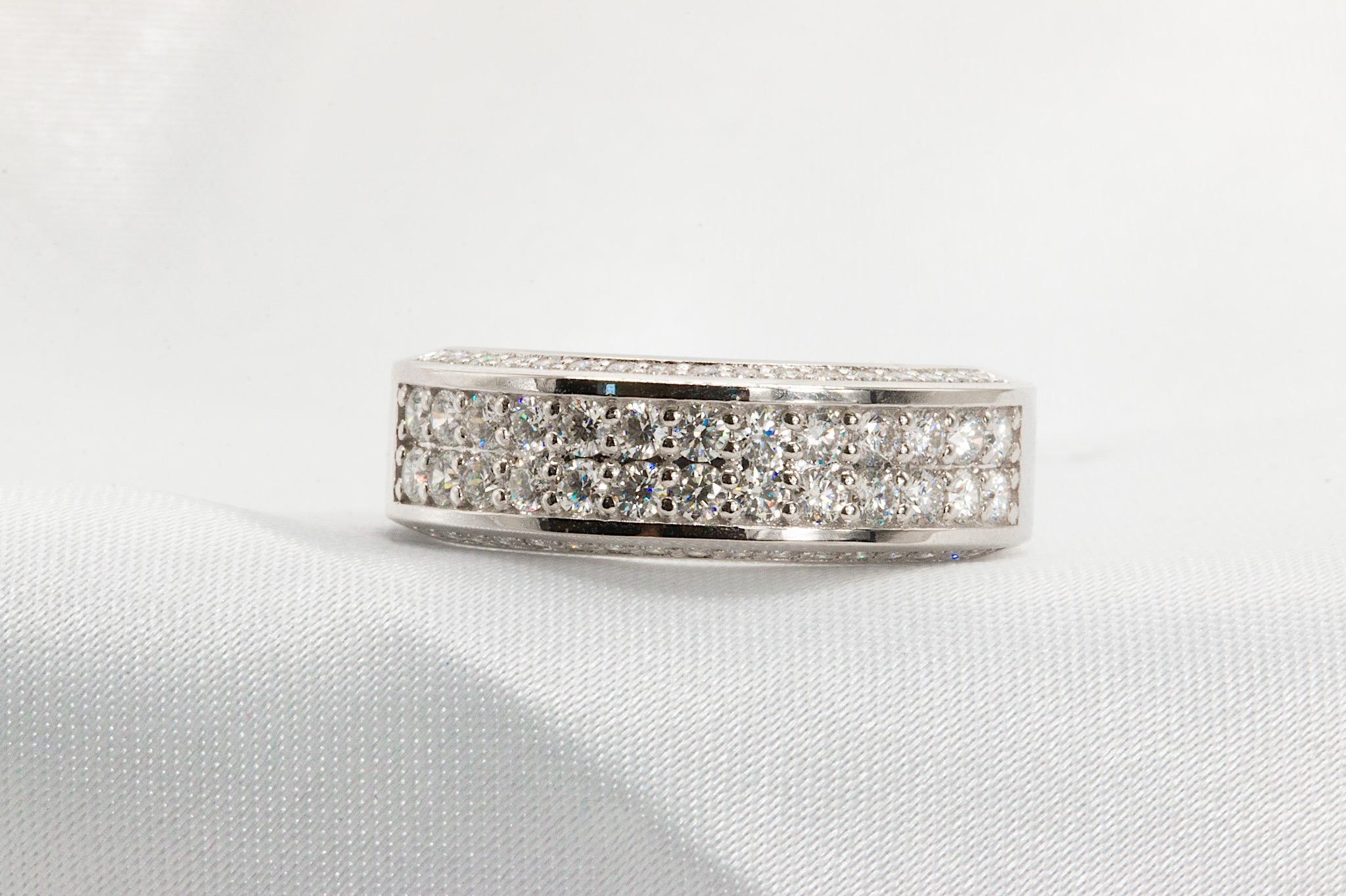 14K White Gold 1.25 CT Diamond Wedding Band

Expertly crafted in 14K white gold, this elegant diamond wedding band weighs 6.3 grams and features a gracefully tapered design—measuring 6.9mm at its widest point and narrowing to 5.1mm. Built with