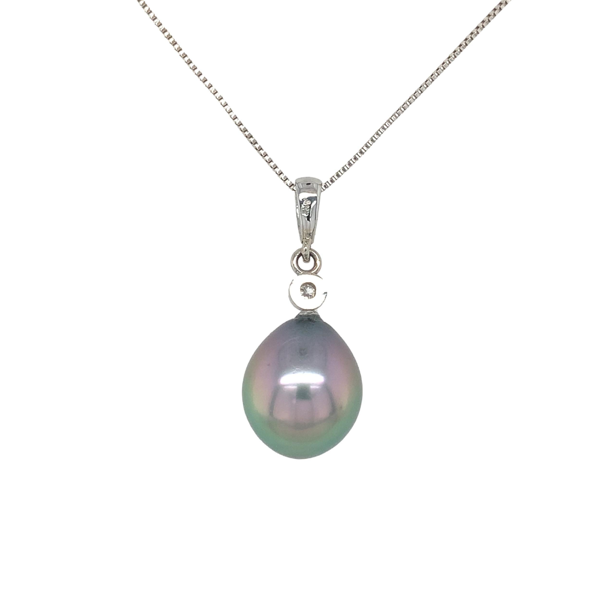 14K white gold pendant featuring a large 12.5mm black cultured Tahitian pearl. The pearl is a fine quality with peacock and aubergine overtones. It is a drop shape and is very clean without blemishes. There are 6 small round brilliant cut diamond