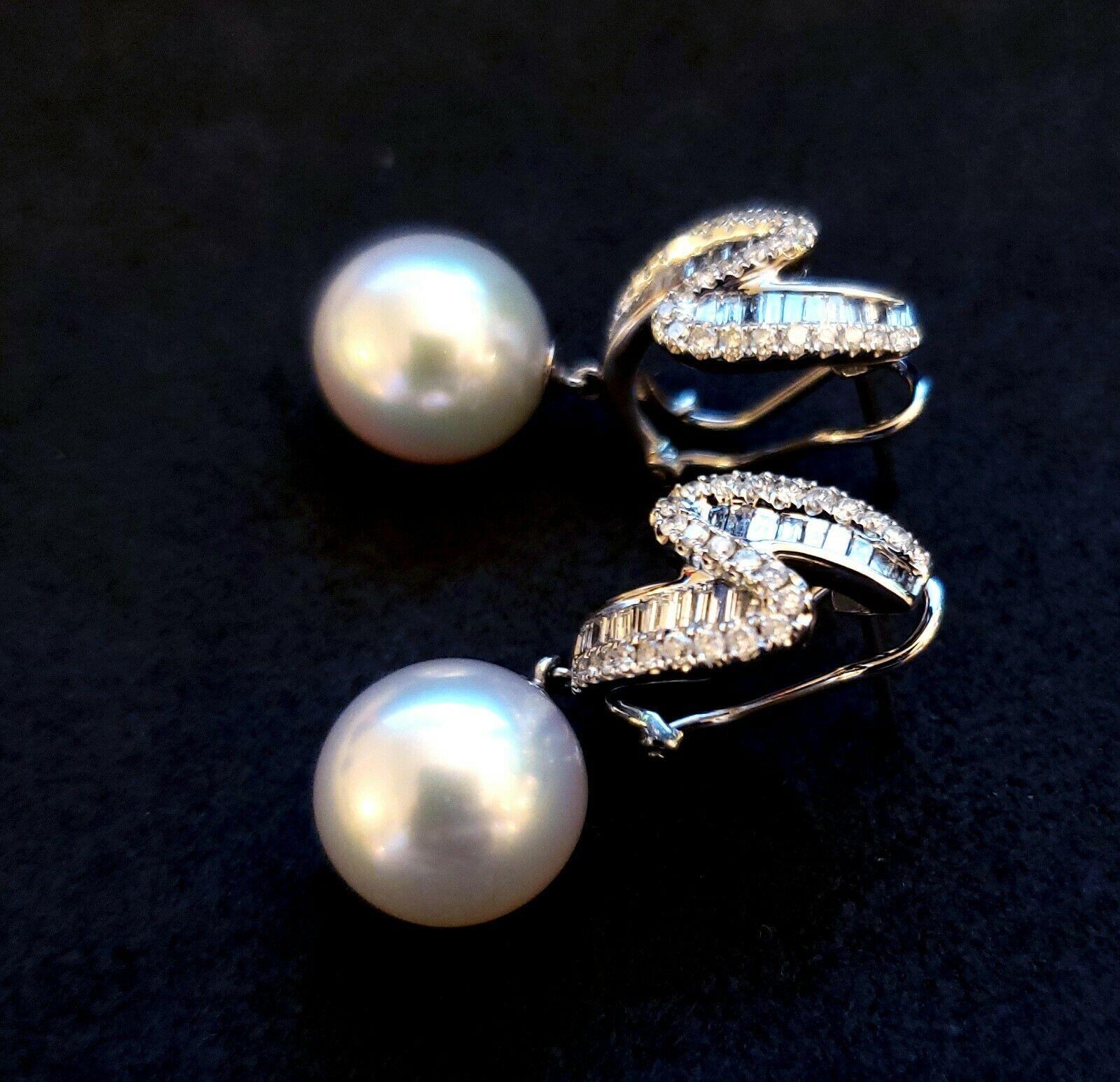 Beautiful and amazing craftsmanship on this 14k white gold, 12mm round south sea pearl earrings, with approximately 1 carat total weight of round and baguette diamonds. With a left and right style.
Specifications:
    main stone:12MM SOUTH SEA