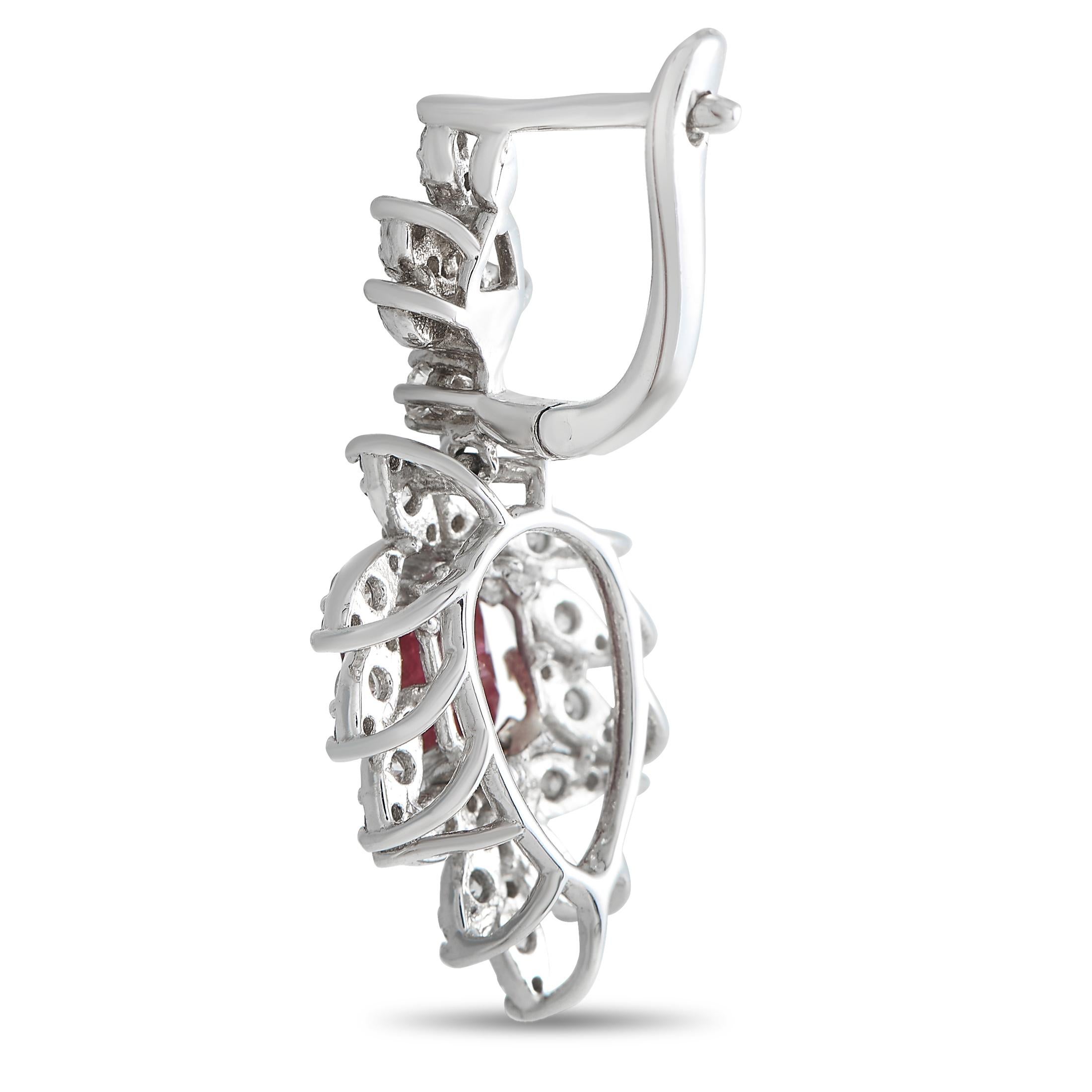 The bold and bright drop earrings to wear for a refreshed style. This pair in white gold features multiple leaf-shaped settings embellished with diamonds on shared prongs. The sparkling leaf-shaped baskets frame a gorgeous ruby gemstone.This pair of