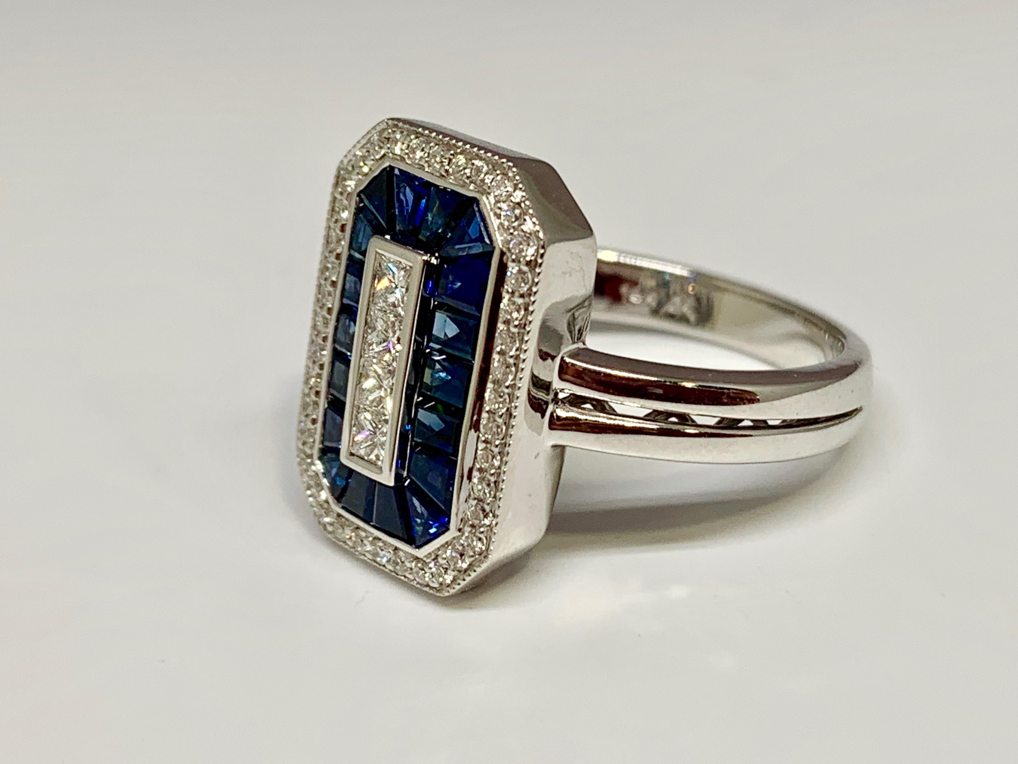 This Allison-Kaufman Company cocktail ring features 1.04 carats of deep blue sapphires and 0.32 carats of gorgeous round and princess cut diamonds. The 14K white gold mounting is currently a size 6.5 but can be resized upon request. The face of the