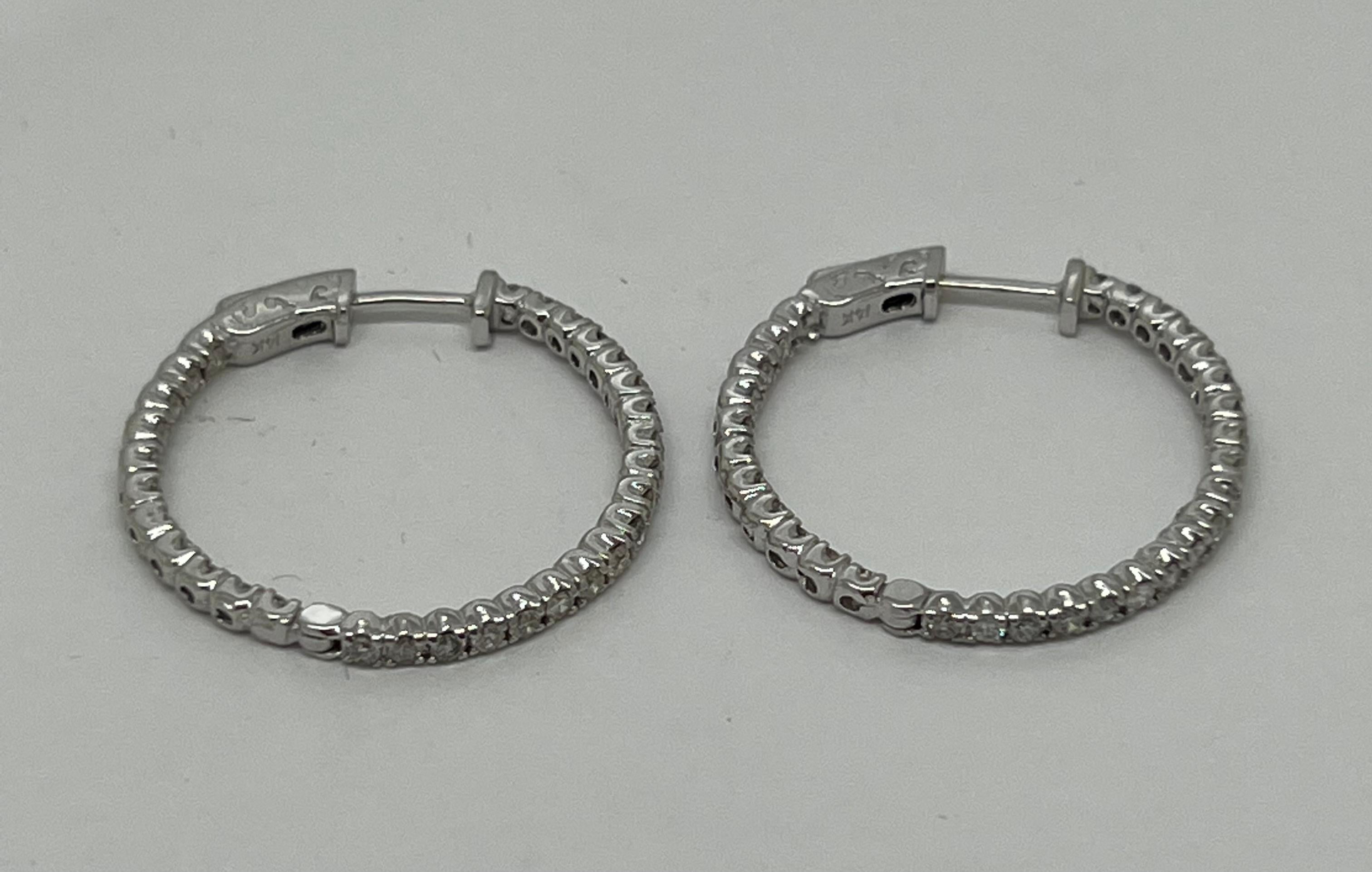 Up for sale:

This absolutely stunning 14k white gold round cut natural diamond in & out hoop earrings. The earrings are featuring approx 1.50ctw in round cut natural diamonds, G color; VS2 clarity; very good cut--Amazing life and brilliance!

These