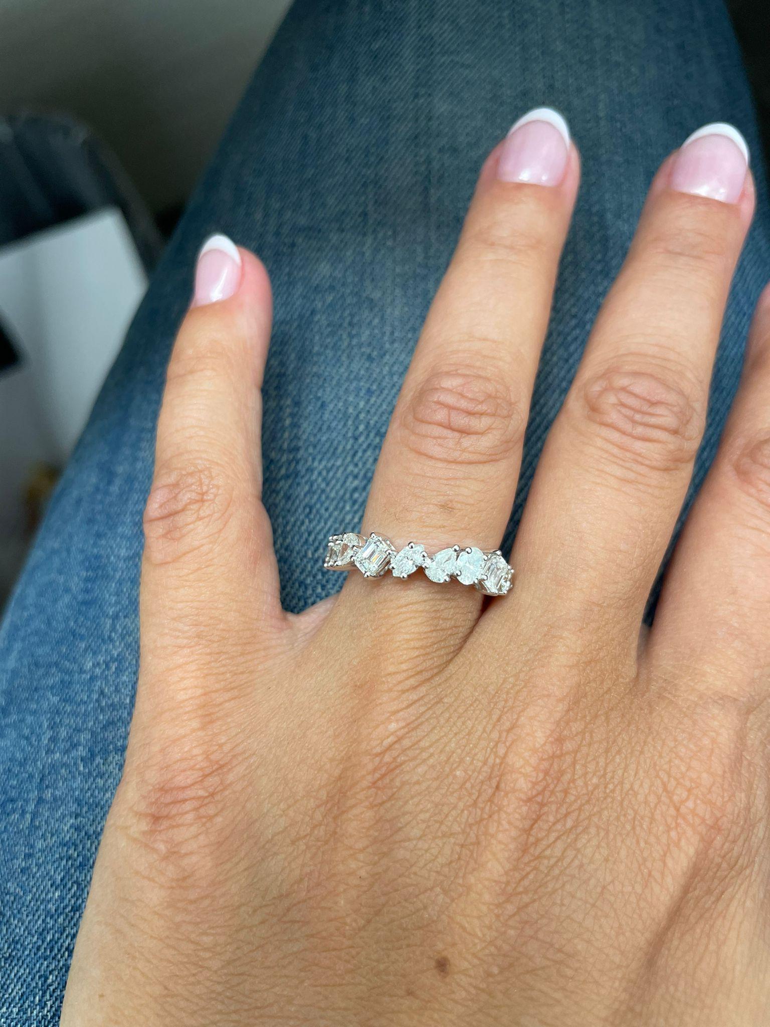 This Elegant and Charming half way around Band crafted of 14K Gold features 10 Diamonds weighing 1.59cts, Diamond Color & Clarity is GH-SI1. This Ring can be sized one size up or down by your Jeweler. Size 7
 
 14K Gold
 10 Natural Diamonds 1.59ct