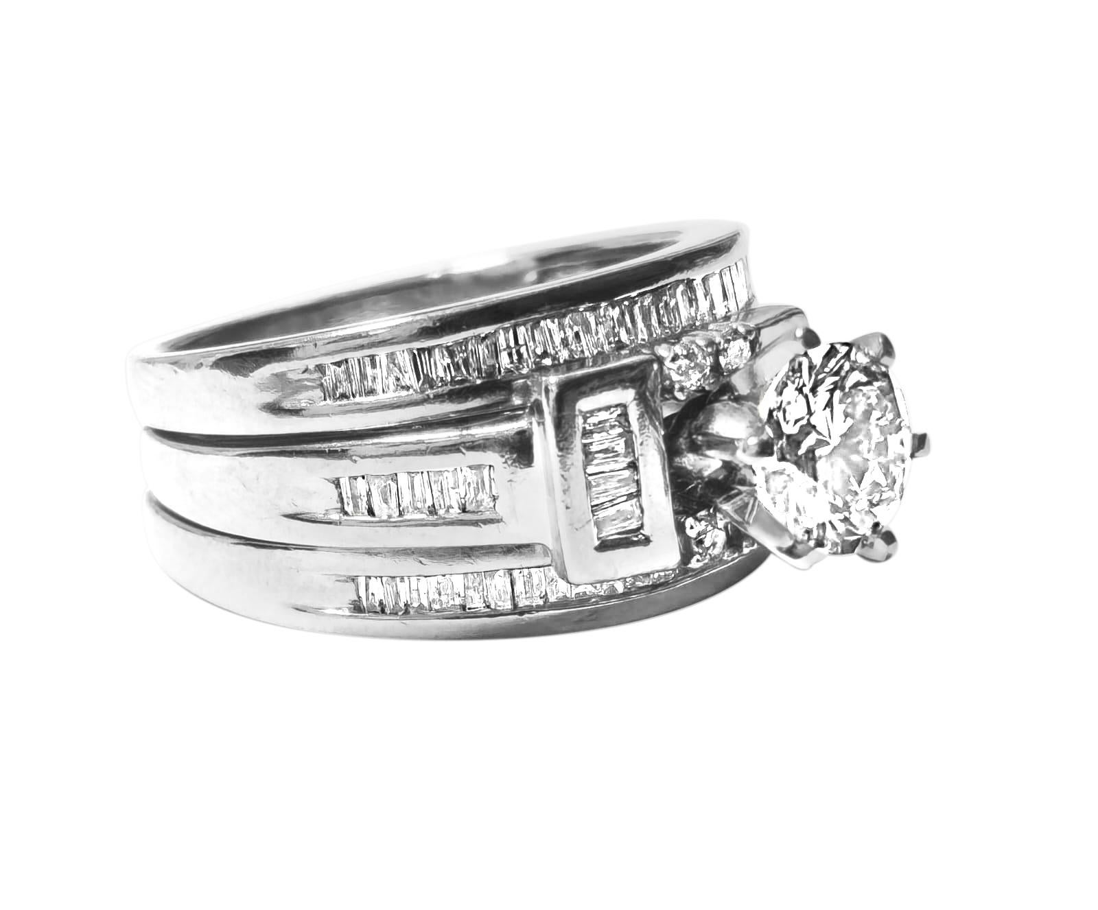 Crafted from elegant 14k white gold, this exquisite ring features a central stone weighing 1 carat, boasting SI1/SI2 clarity and L-M color, exuding subtle warmth and charm. Surrounding the centerpiece are side stones totaling 1 carat, with VS2/SI1