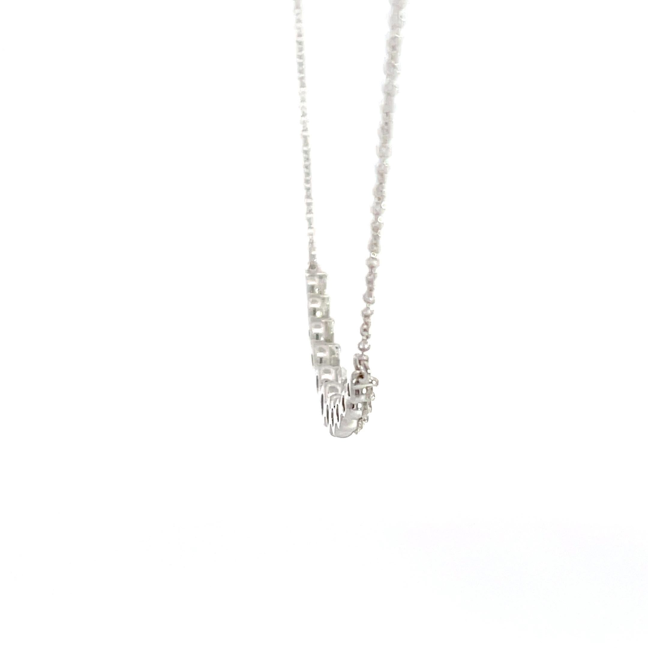 Beautiful 14K white gold diamond smile necklace. Can also be called a graduated, curved, or bar necklace. This fashion forward look can be dressed up, dressed down, and worn for any and all occasions. The diamond quality is white GH in color and SI