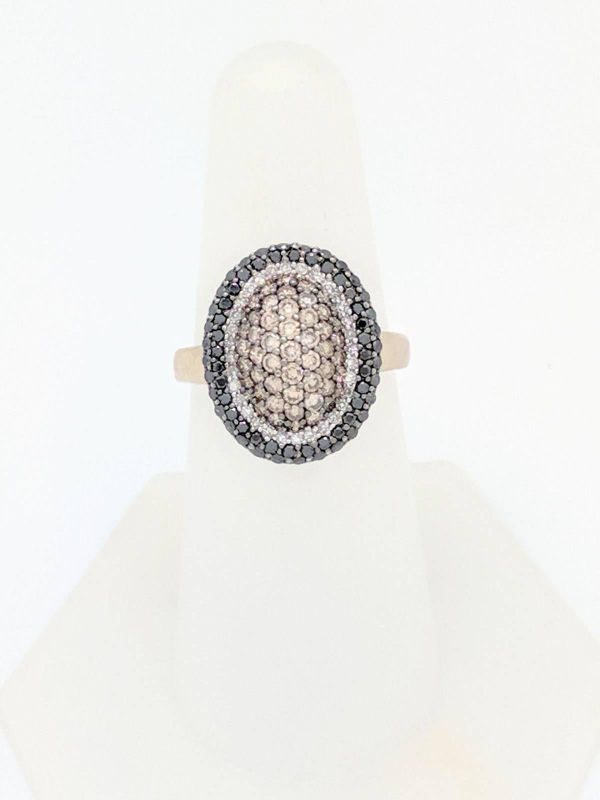 Ladies 14K White Gold 1ctw Pave Set White, Black & Champagne Diamond Ring Size 7

You are viewing a beautiful Champagne, Black & White Diamond Ring. This ring is crafted from 14k white gold and weigh 5.9 grams. This ring features (64) round natural