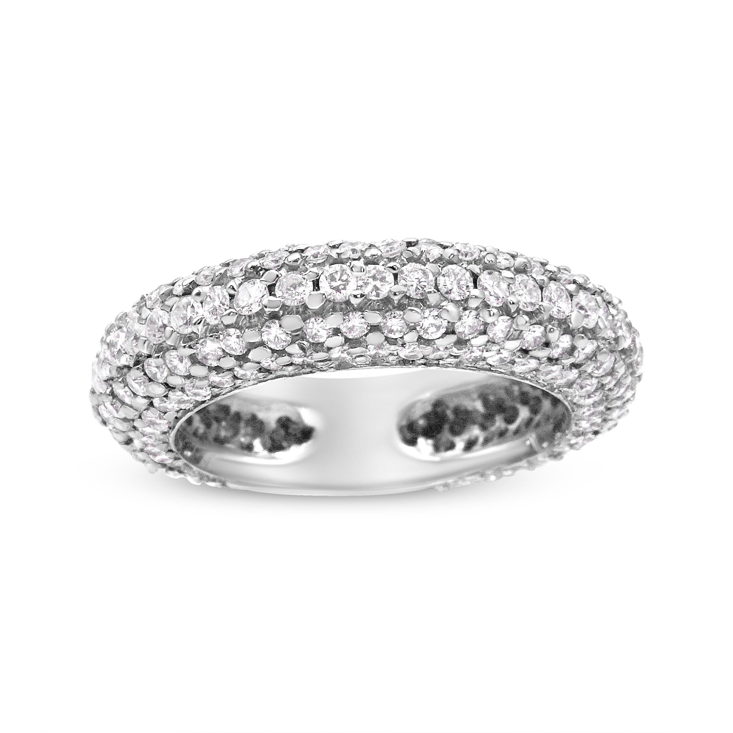 Indulge in the splendor of this exquisite ring, skillfully crafted to showcase a stunning array of pave set natural diamonds. The design features multiple rows of these authentic diamonds, meticulously arranged to cover the majority of the ring's