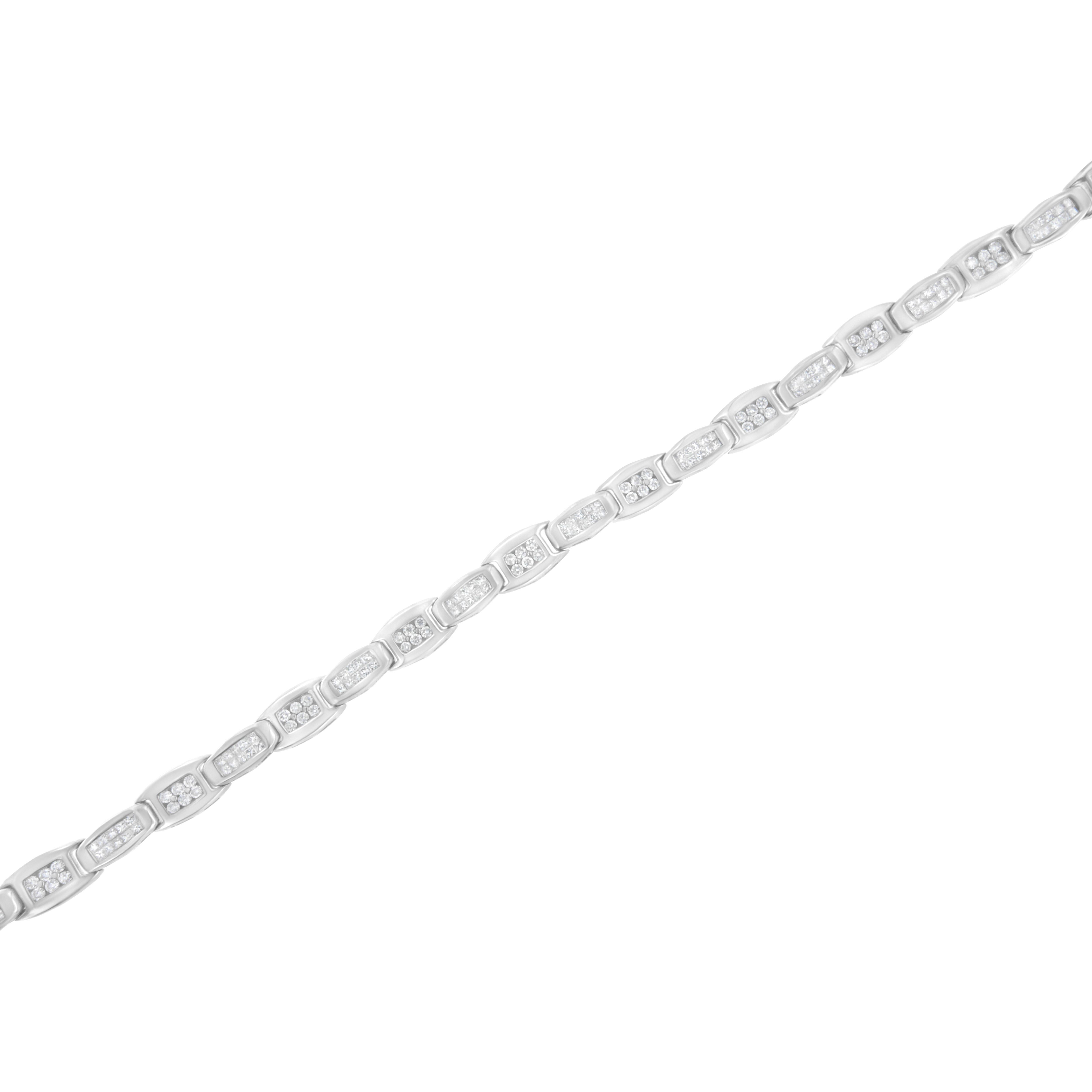 This gorgeous bracelet is designed with smaller white gold bands linking with larger bands. The smaller gold bands sparkle with two rows of princess cut diamonds while the larger ones hold six prong set round cut diamonds. This 14k white gold tennis
