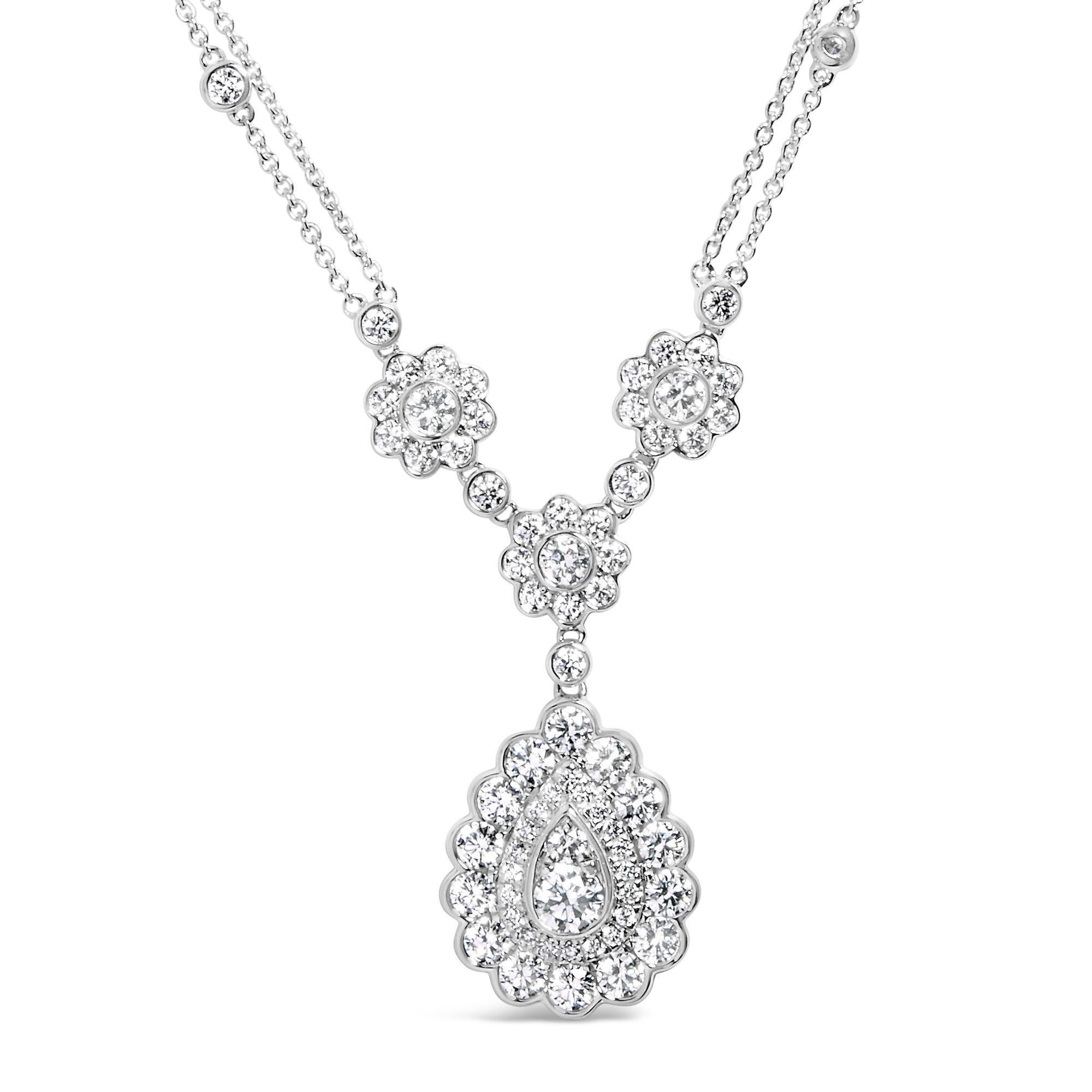 Imbued with the luminescence of a star-studded night, this exquisite necklace is masterfully crafted from 14K white gold with a rhodium plate finish that enhances its celestial glow. At its heart lies a captivating oval cluster of natural diamonds,
