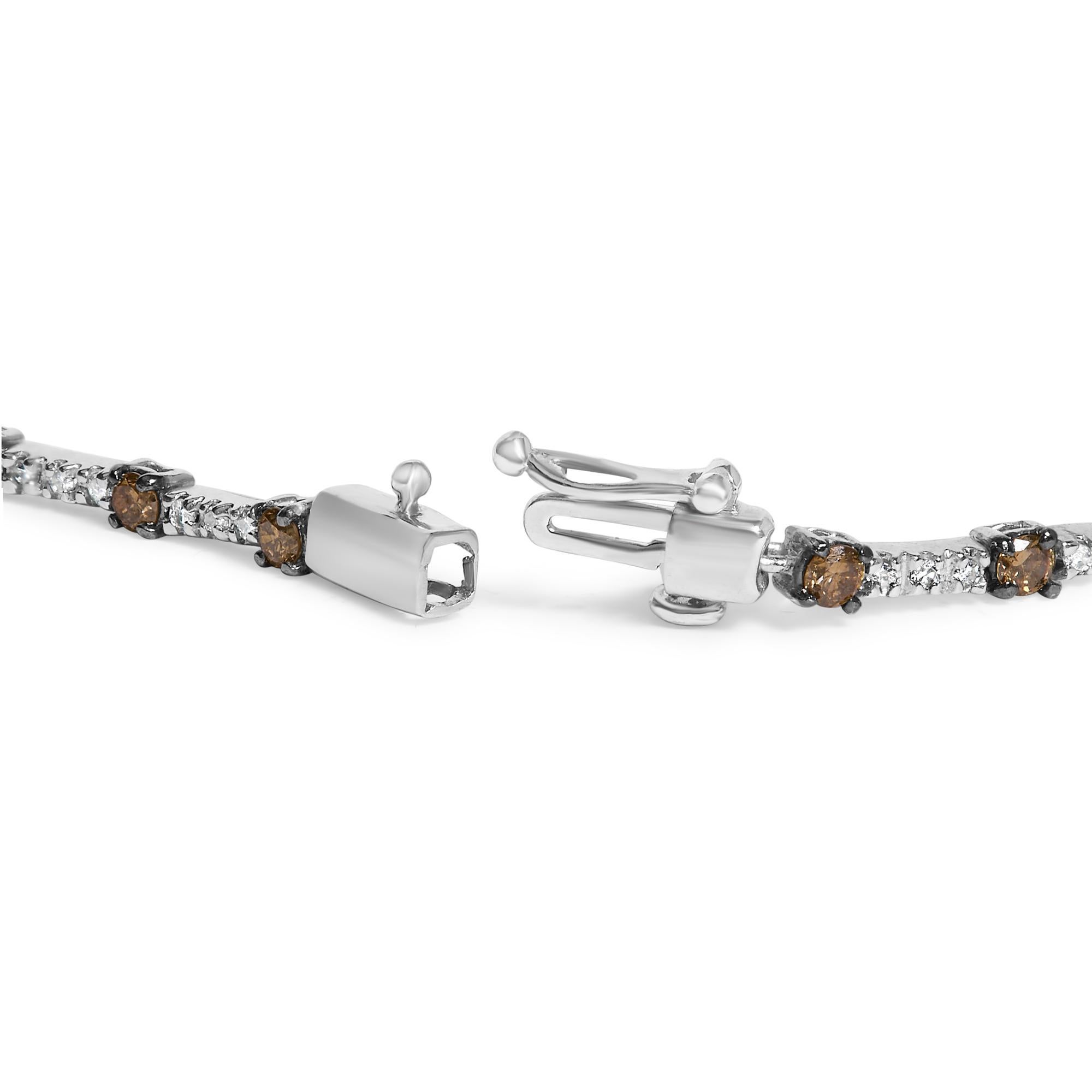 Imbued with the sublime elegance of the evening sky, this 14k white gold bracelet glimmers with a captivating arrangement of natural champagne and white diamonds, totaling 2 1/4 cttw. Each champagne diamond, colored like fine aged brandy, is