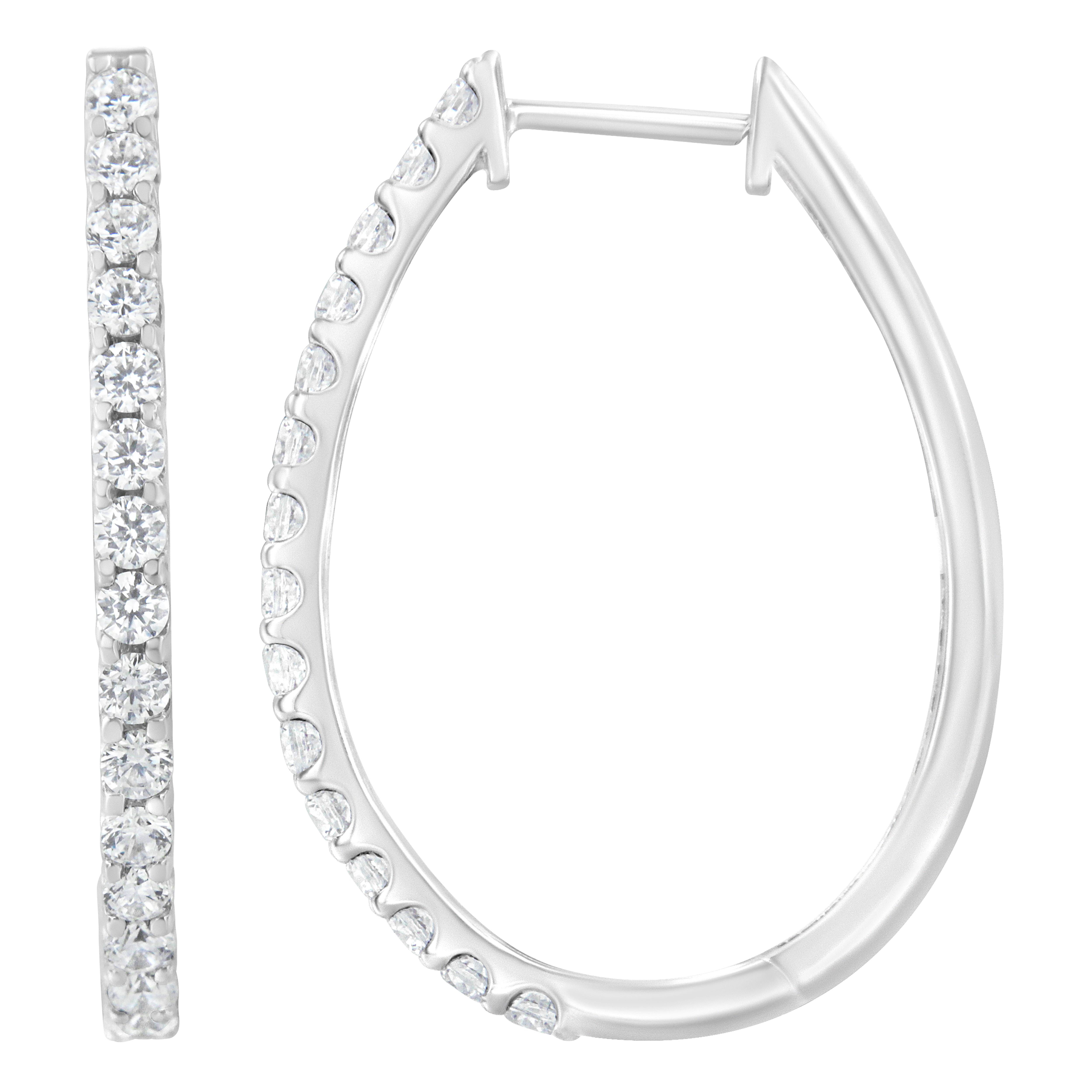 These glamorous 14k white gold hoop earrings showcase 2 ct of round cut diamonds. The prong set diamonds inlay half the outside of the hoops giving them maximum sparkle. These gorgeous hoop earrings are the perfect gift for that trendy, special