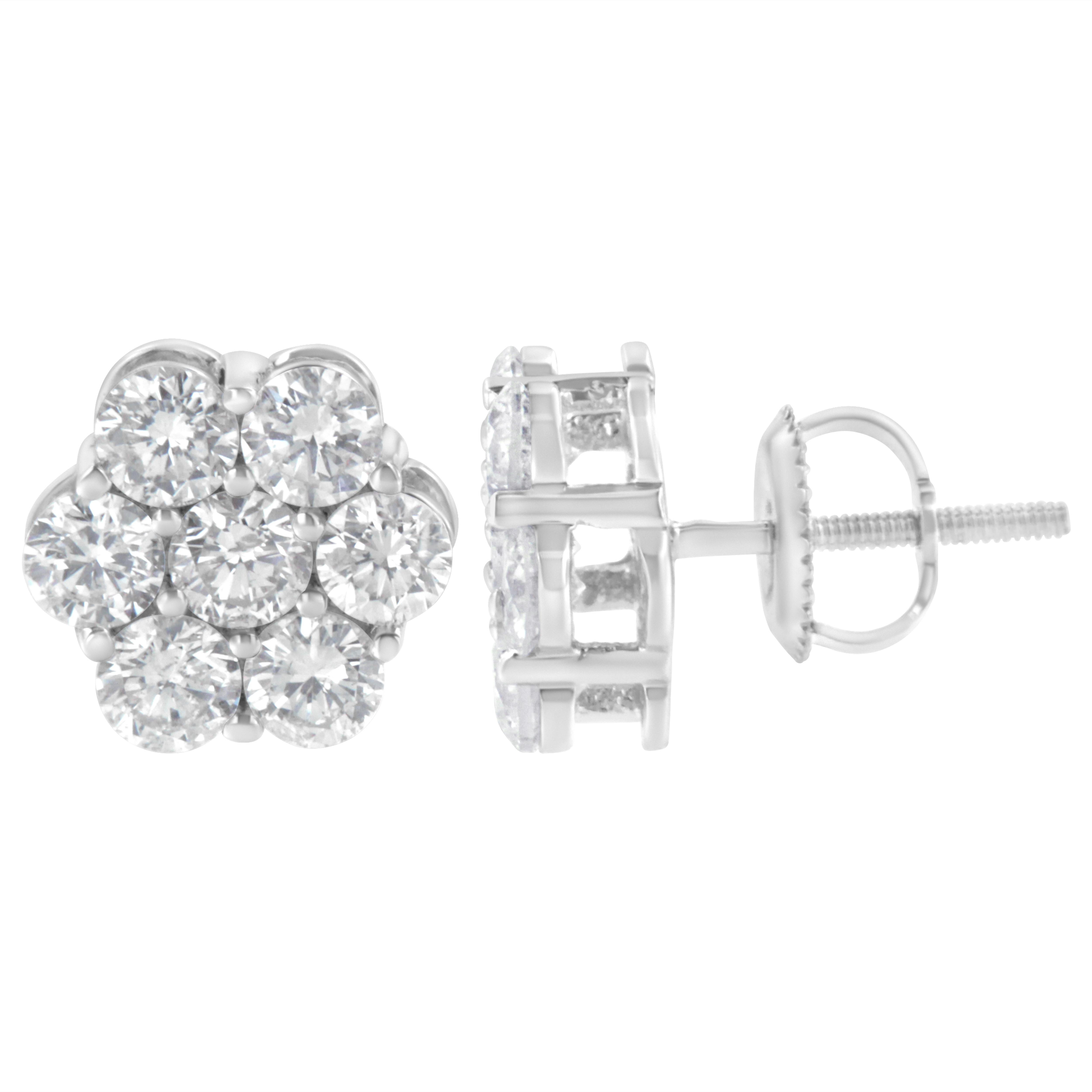 You will fall in love with these classic cluster stud earrings. A must have for any serious jewelry collection, these 14K white gold earrings boast an impressive 2.0 carat total weight of diamonds with seven stones each. The earrings are floral