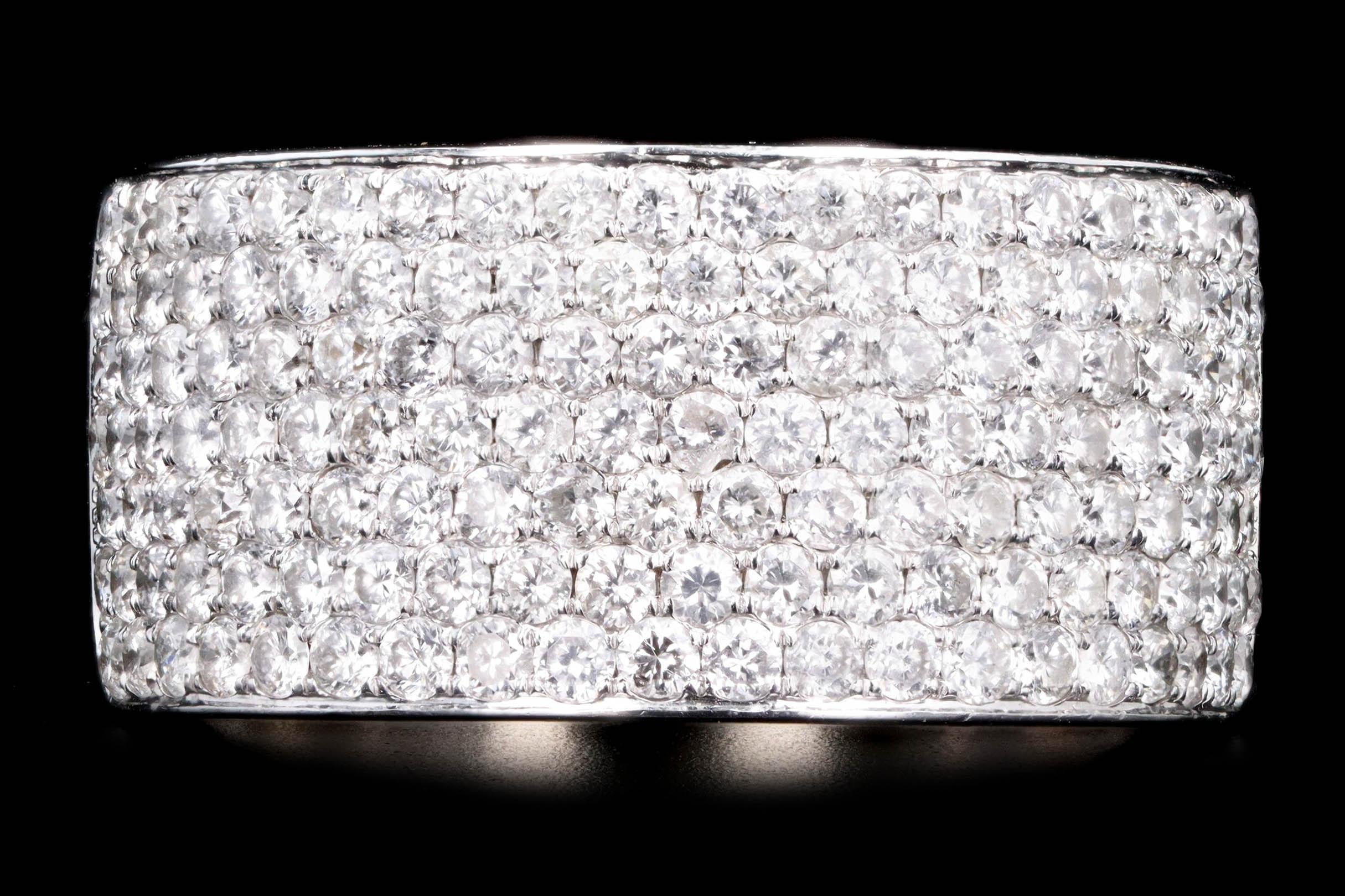 Era: Modern

Composition: 14K White Gold

Primary Stone: One Hundred Forty Three Round Brilliant Cut Diamonds

Total Carat Weight: Approximately 2.0 Carats

Color/Clarity: H-I / SI1-2

Ring Size: 8.5

Ring Weight: 7.8 Grams

Item Barcode: 231454