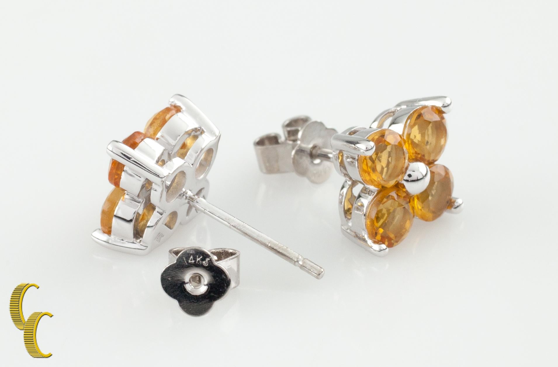 Gorgeous and unique stud earrings.
Features 14k white gold setting with 8 round yellow sapphires in floral arrangement.
Sapphire Weight: 2.00 Carats.
Dimensions: 8 x 8 mm.
Metal: 14k white gold.
Weight: 3.1 grams.