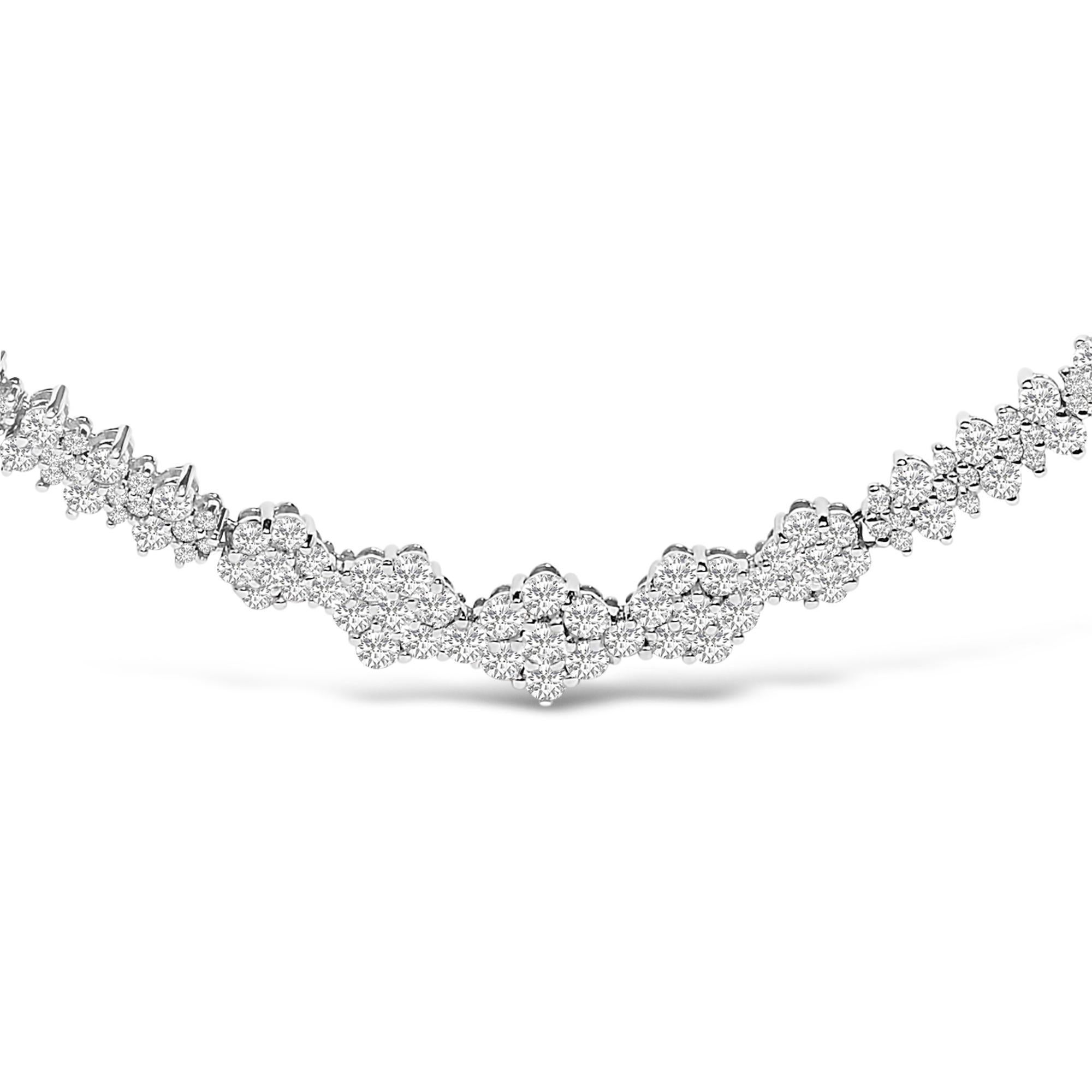 Radiating pure elegance, this exquisite necklace is meticulously crafted from polished 14k white gold, adorned with a harmonious curve of dazzling, natural diamonds totaling 2.00 carats. Encrusted in a shared prong setting, each diamond emanates a