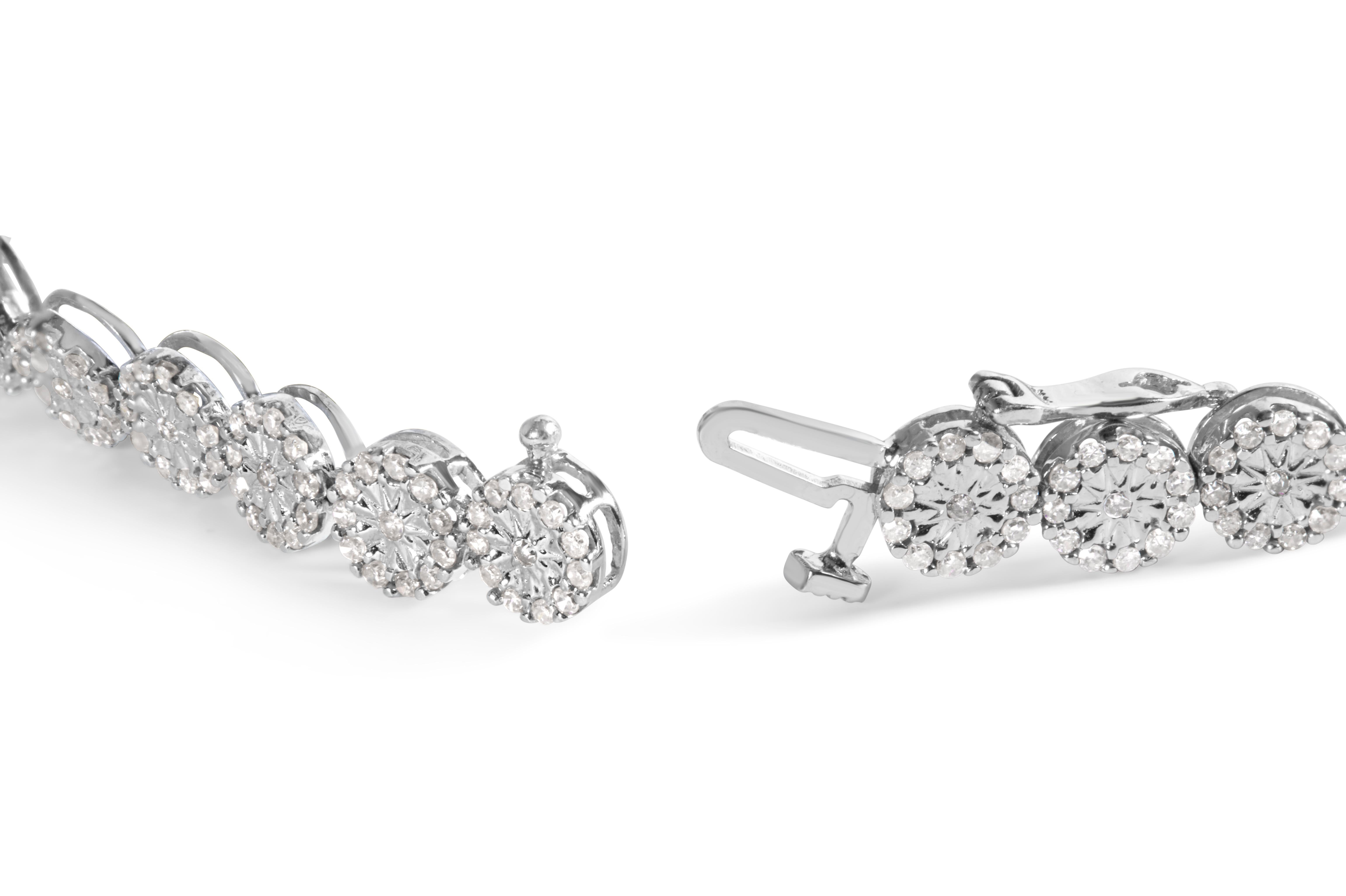 Indulge in the luxurious beauty of this stunning tennis bracelet. Crafted from 14K white gold, this piece features a breathtaking 2.00 Cttw of natural, round diamonds in a halo link design. With 360 diamonds set in a pave setting, the brilliance of