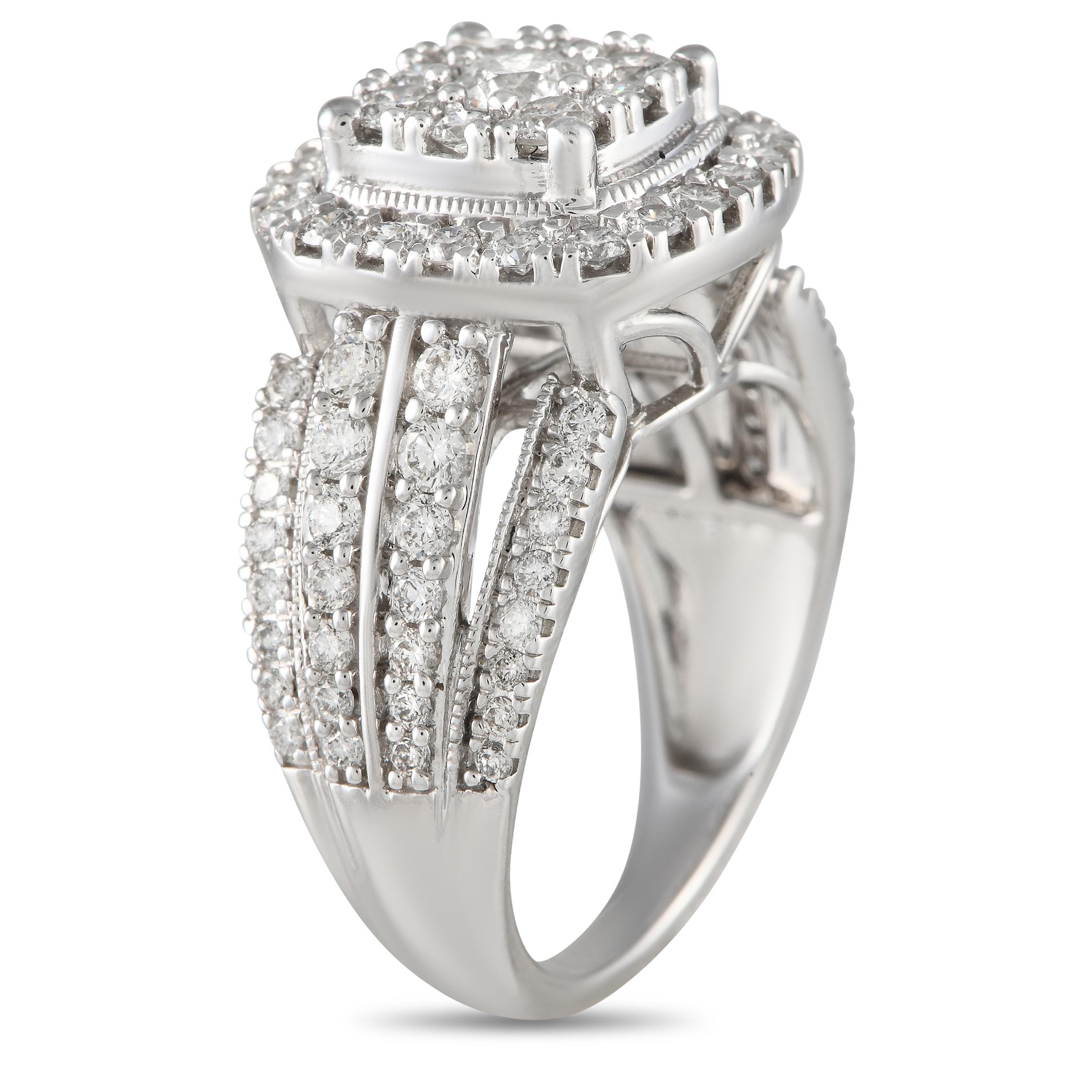 An elaborate, vintage-inspired diamond ring sure to win the heart of an old soul. This 14K white gold piece features a tapering shank with multi-split shoulders embellished with petite diamonds. At its top center is a round diamond surrounded by a