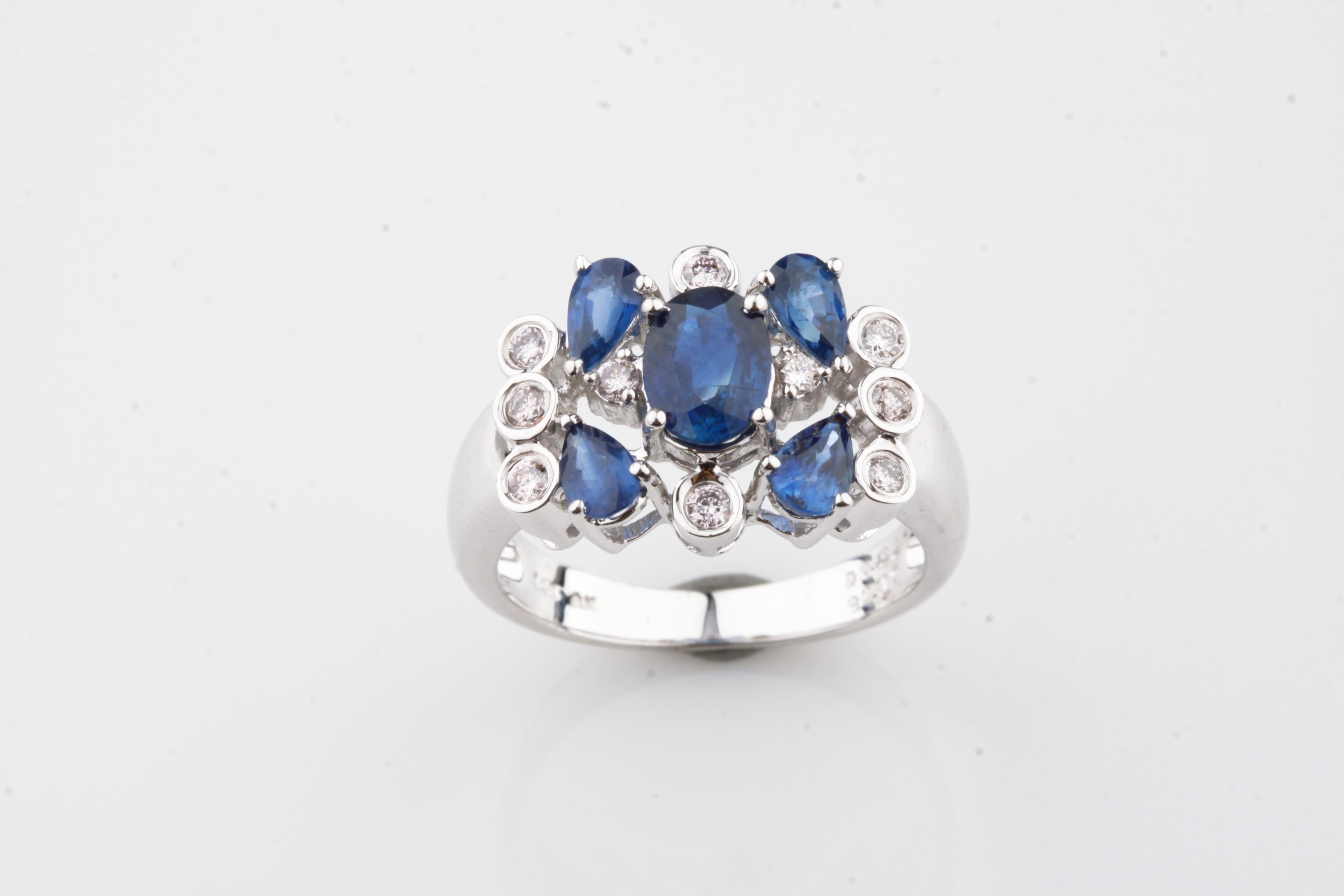 One Electronically tested 14k white gold ladies cast sapphire & diamond cluster ring with a bright finish. Condition is new, good workmanship. Trademark is An. Identified with markings of 