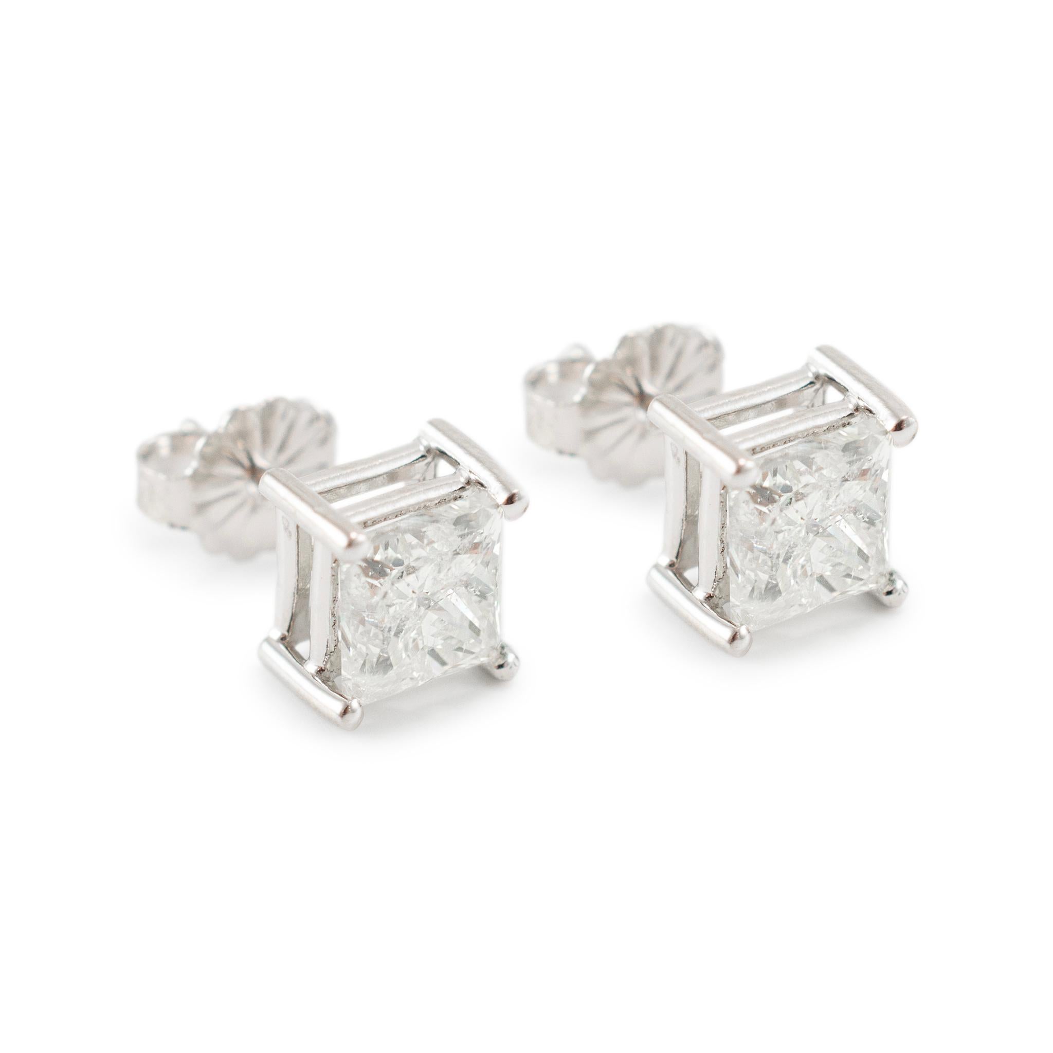 Metal Type: 14K White Gold

Width: 6.65 mm

Weight: 1.79 grams

14K White Gold diamond stud earrings with push backs.  The metal was tested and determined to be 14K white gold. Engraved with 