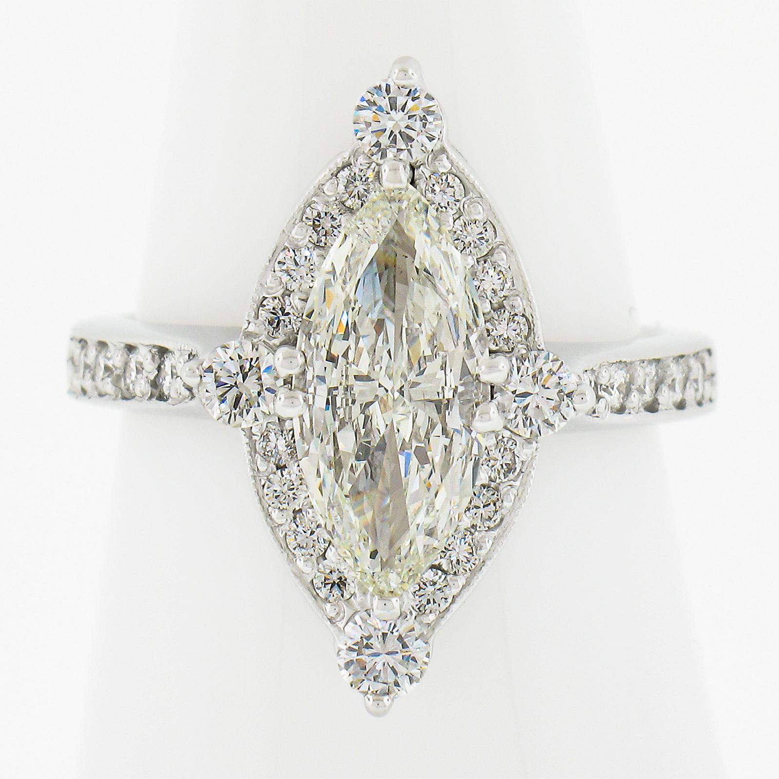 --Stone(s):--
(1) Natural Genuine Diamond - Marquise Cut - Dual Prong Set - Warm K Color - SI2 Clarity - 1.50ct (exact - certified)
** See Certification Details Below for Complete Info **
(32) Natural Genuine Diamonds - Round Brilliant Cut - Prong &