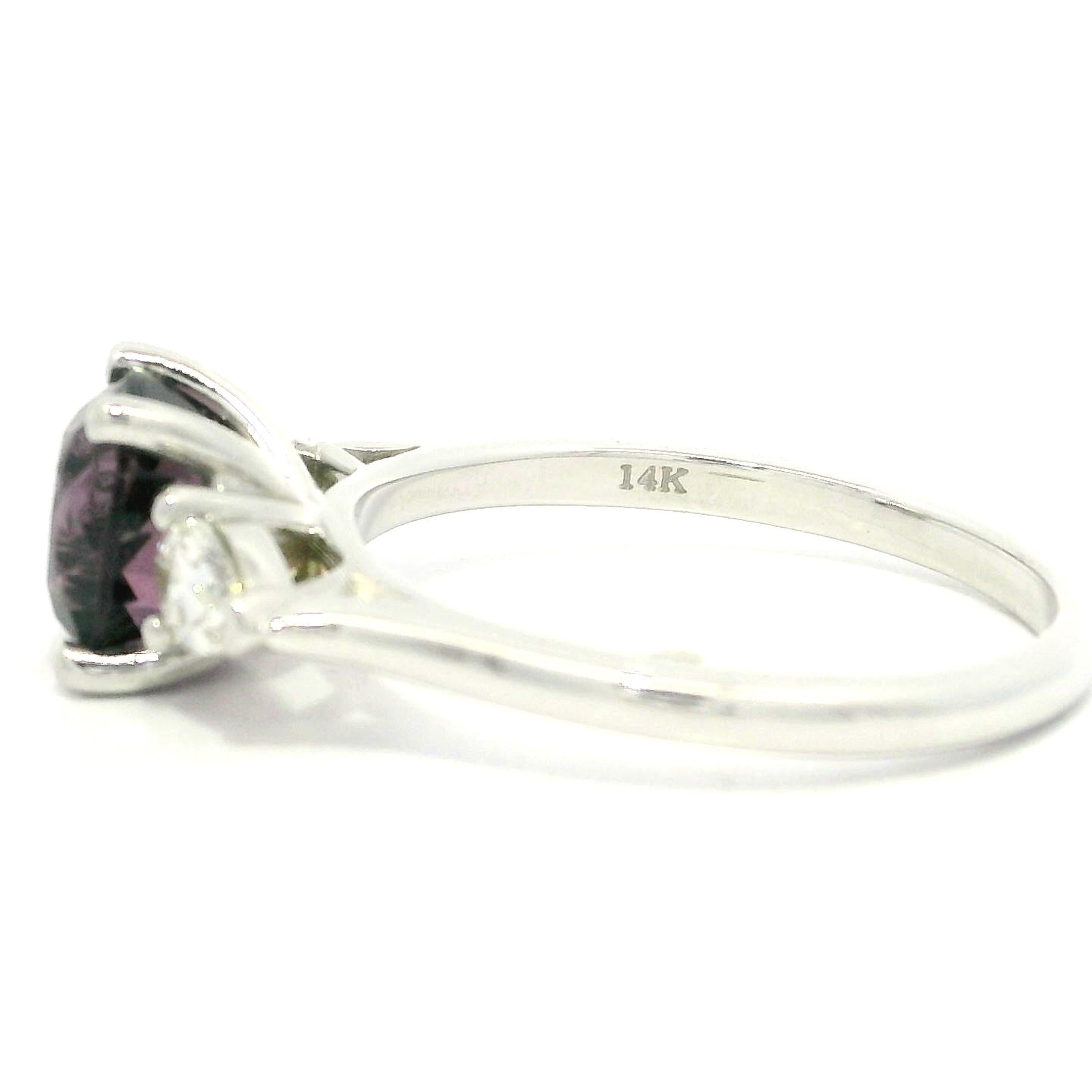 --Stone(s):--
(1) Natural Genuine Spinel - Cushion Brilliant Cut - Prong Set - Pinkish Purple Color - NO HEAT - 2.10ct (exact)
** See Certification Details Below for Complete Info **
(2) Natural Genuine Diamonds - Pear Cut - Prong Set - Nice