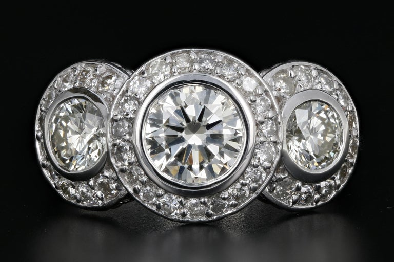 14 Karat White Gold 2.45 Carat 3Stone Diamond Halo Ring at 1stdibs