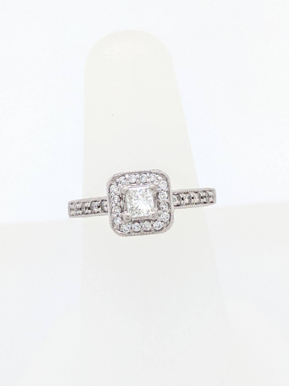 14K White Gold .24ct Princess Cut Diamond Halo Engagement Ring SI2/H Size 6

You are viewing a .24ct natural princess cut diamond set in a halo engagement ring. The center stone is beautifully displayed in a 14k white gold diamond halo engagement