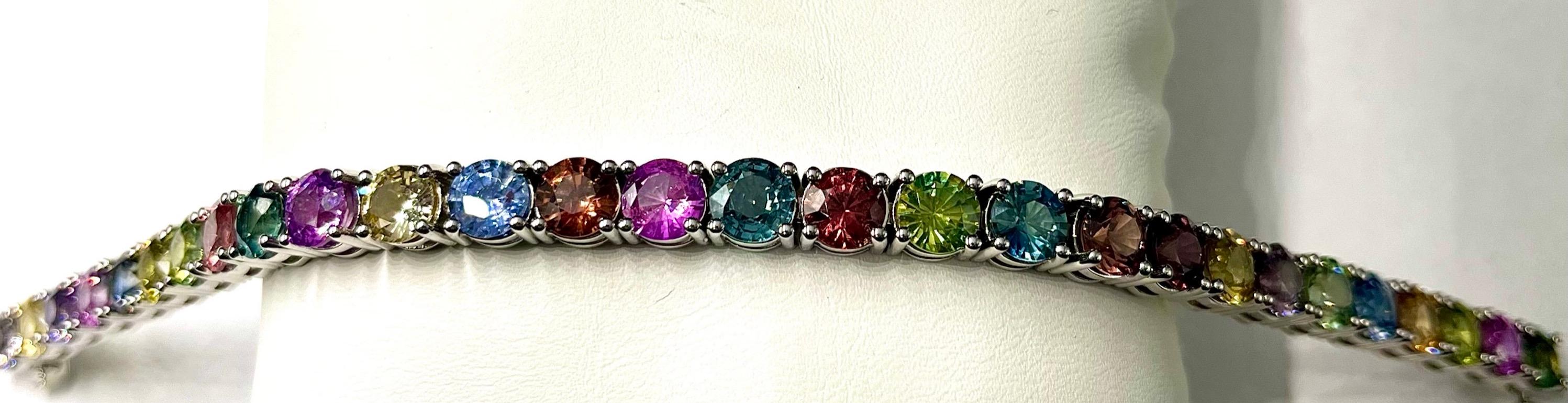 This is an absolutely beautiful bracelet with a rainbow array of colors of Natural Round Sapphires. These sapphires are very clean and the colors are vibrant, rich and highly brilliant. This color combination offers a great variety of colors. This