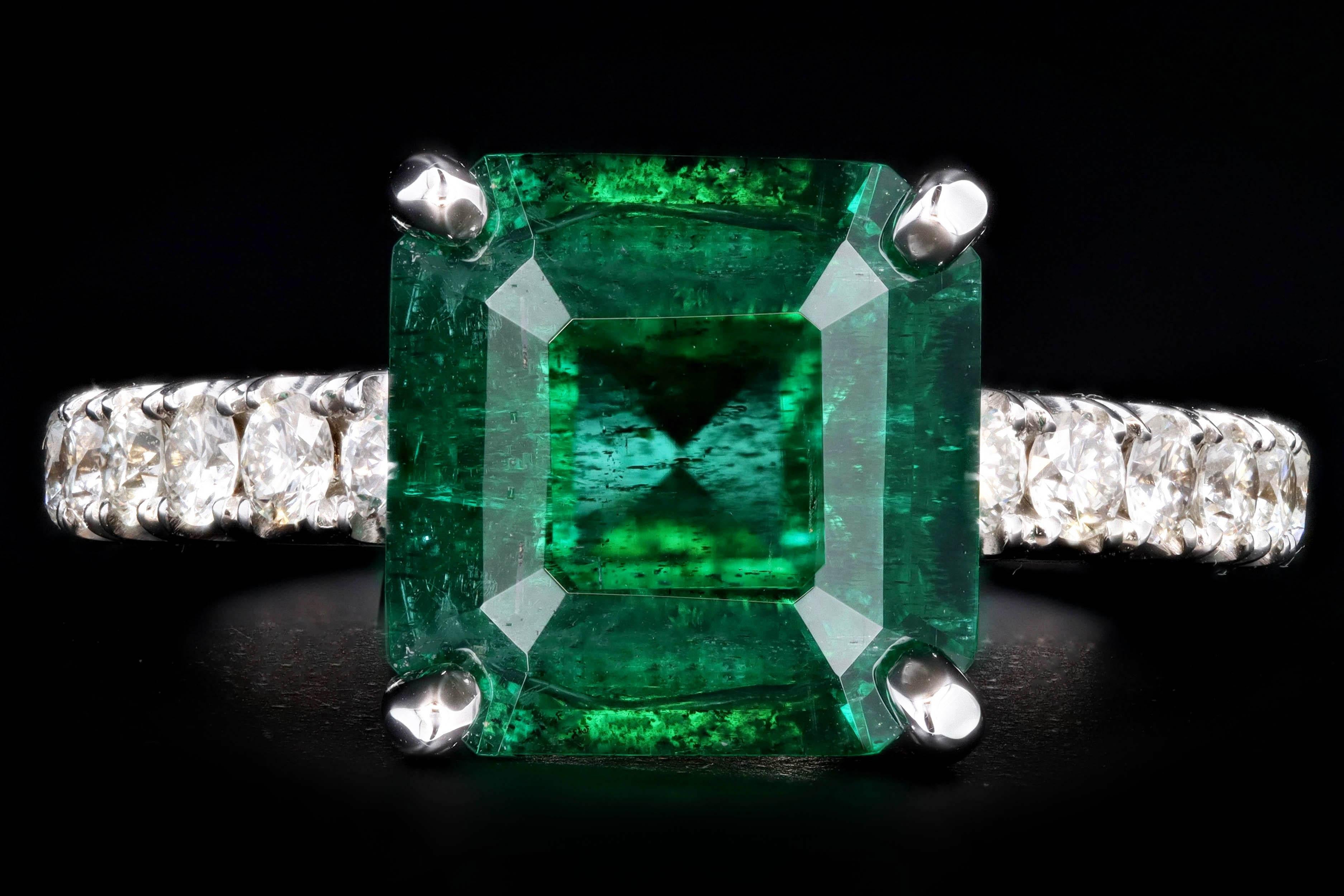 Era: Modern

Composition: 14K White Gold

Primary Stone: Natural Emerald

Origin: Zambia 

Carat Weight: 2.83 Carats

Accent Stone: Round Brilliant Diamonds 

Carat Weight: Approximately 0.65 Carats

Color/ Clarity: H/I - VS2/SI1

Ring Size: