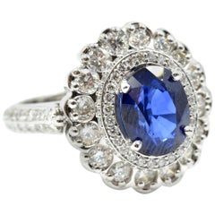 14k White Gold 2.95ct Oval Blue Sapphire, and 2.07cttw Round Diamond Halo Ring 