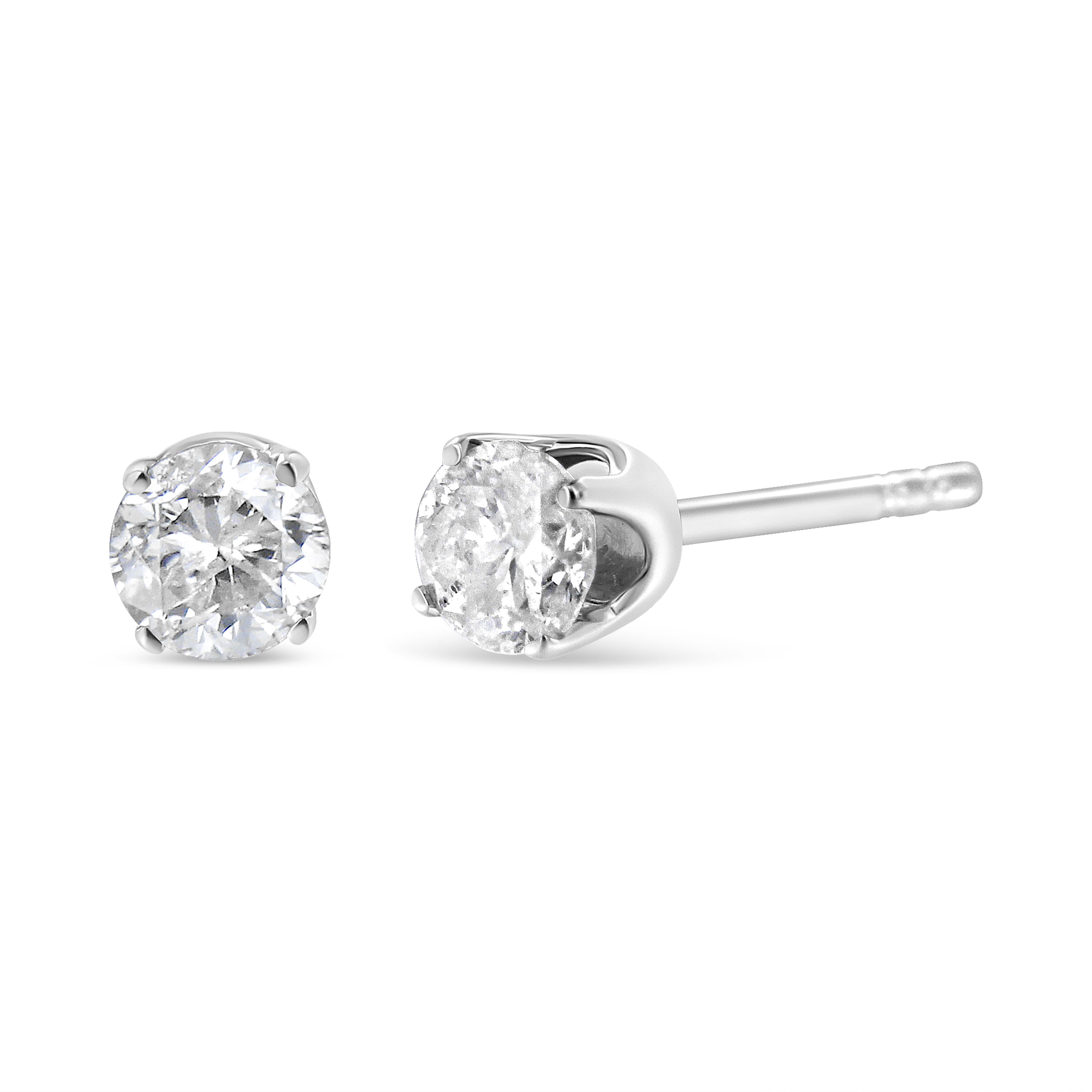 Two gorgeous white diamonds sit in a prong setting on these sparkling stud earrings. Crafted in your choice of 14k yellow or white gold, these diamond stud earrings feature a high polish finish. These stunning gold earrings feature 0.75 carats of