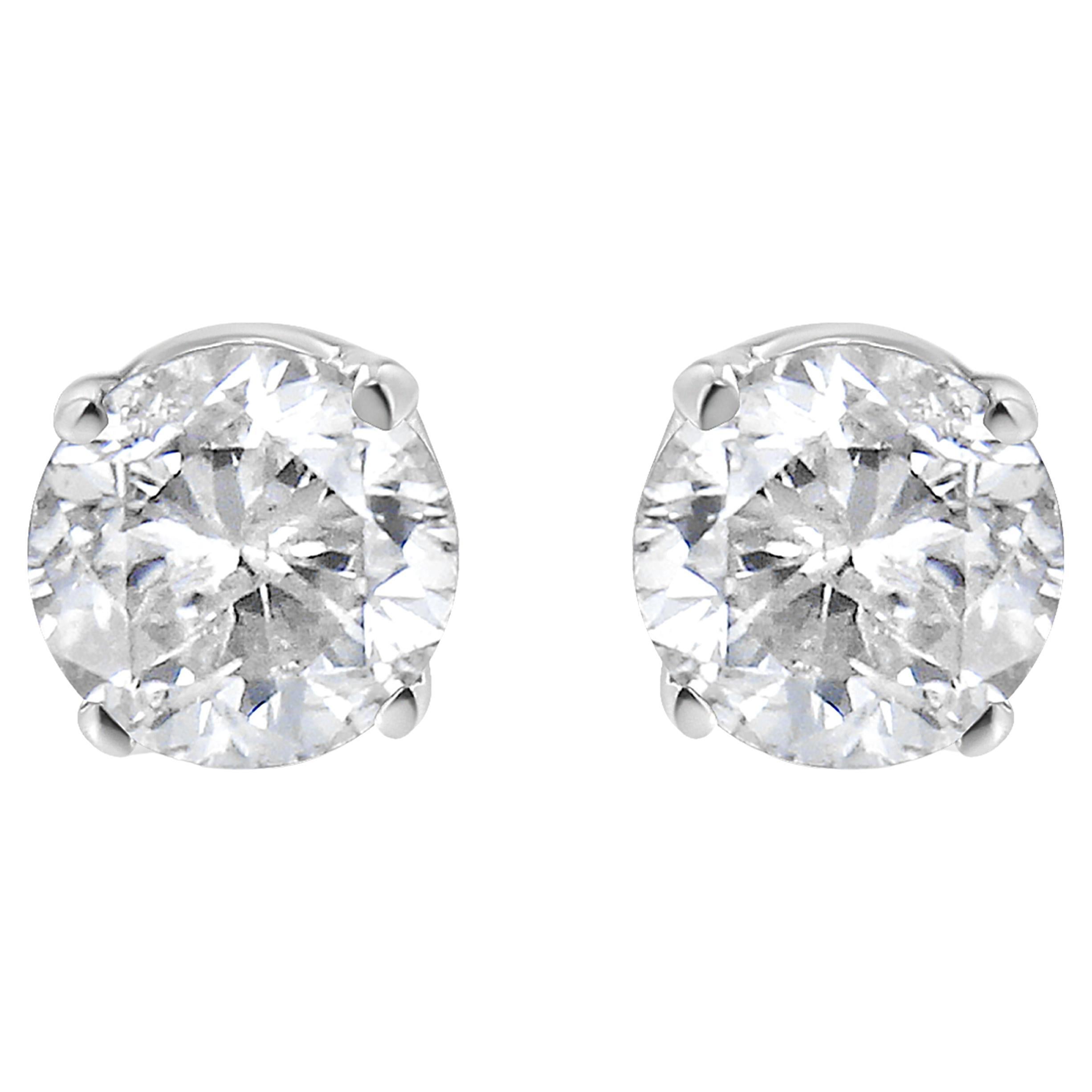 Clous d'oreilles solitaires en or blanc 14 carats avec diamants de 3/4 carat en vente